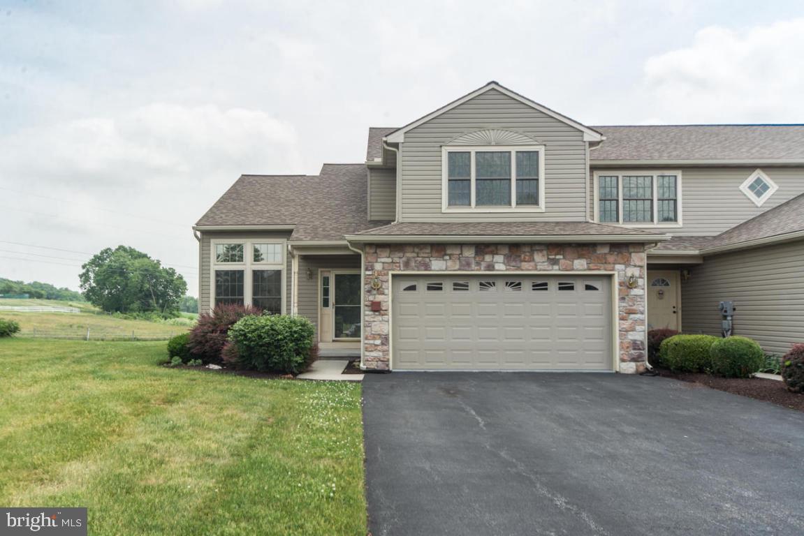 ONE OF THE LARGEST WITH MOST UPGRADES IN HIGHLY DESIRABLE VILLAGE COMMONS CONVENIENTLY LOCATED TO ROUTE 30/741/283 FOR EASY ACCESS TO LANCASTER, YORK OR DAUPHIN COUNTIES. THIS BRIGHT END UNIT BOASTS SOARING CATHEDRAL CEILING IN FAMILY ROOM WITH GAS FIREPLACE, ENERGY EFFICIENT CEILING FANS IN MOST ROOMS KITCHEN  OPENS TO DINING AREA, SUNNY SUNROOM WITH SLIDING DOORS TO DECK OVERLOOKING GORGEOUS PANORAMIC FARM VIEWS,