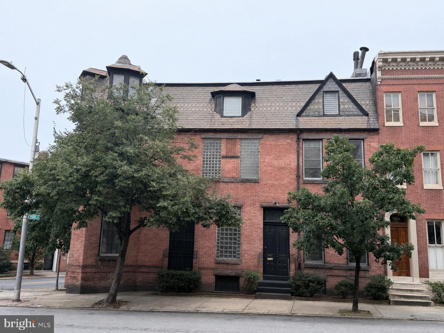 Rare opportunity to restore a piece of Mount Vernon's history! Built in 1880, this impressive historic townhome was once owned by a physician who operated his medical practice on the main level while living on the upper floors. The home was converted back to a private residence in 1987 and is ready for its next chapter.
Priced to reflect its current condition, this townhome presents an outstanding renovation opportunity. The property requires a complete renovation, including major systems. There is an active roof leak, and the air conditioning system is not operational. Due to its current condition, the property is not expected to qualify for most conventional financing. Buyers should consult with their lender regarding available financing options.
Located in the heart of Baltimore City's historic Mount Vernon district, this spacious townhome is surrounded by beautifully restored historic properties and offers endless possibilities for restoration. Renovations are subject to applicable CHAP (Commission for Historical and Architectural Preservation) guidelines. Buyers are encouraged to independently verify available historic preservation incentives and tax credit programs.
Sale is subject to HUD approval as a reverse mortgage short sale. A short sale attorney has been retained and is actively working with the loan servicer and HUD throughout the approval process. The approval process may take six months or longer.
If you've been searching for a historic Mount Vernon townhome with remarkable character and exceptional restoration potential, this is an opportunity you won't want to miss. Bring your vision and breathe new life into this classic Baltimore property.