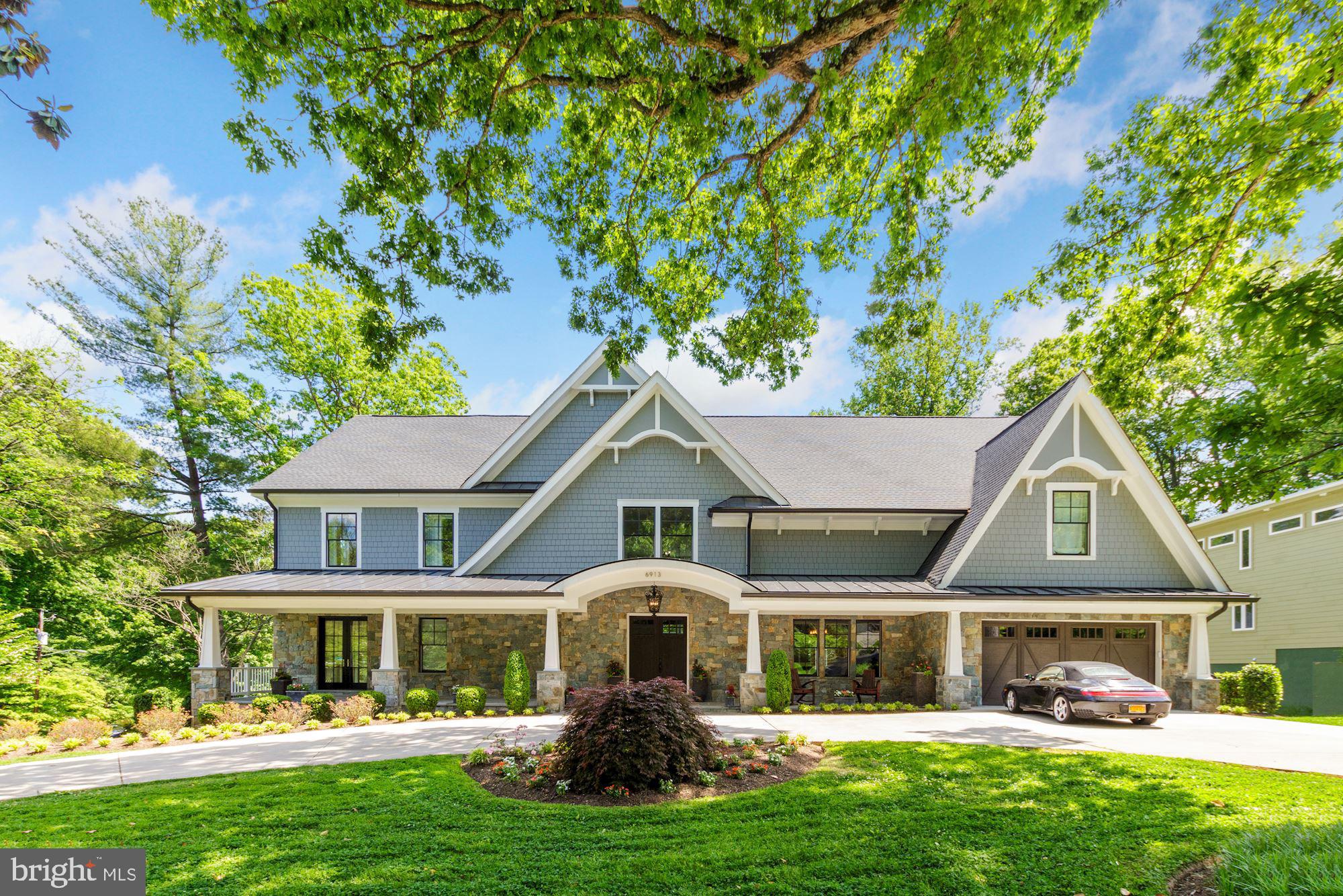The buyer was an agent and forfeited buyer commission. Open house cancelled! . With nearly 10,000 square feet of finished space, this Bannockburn Estate residence is a stunning home with grand entertaining spaces and spacious, private bedroom suites. Rich, hardwood floors flow throughout the main level's open floor plan. Owner's and guests are welcomed into an impressive two- story foyer and living room with stunning 24' floor-to-ceiling windows. An elegant, dual-sided fireplace divides the living and sitting rooms while the wall of glass windows look out over the rear balcony and garden. The main living area flows into the state-of-the-art kitchen. Expansive and beautifully crafted, the kitchen island features a prep sink, breakfast bar seating and a beverage mini-refrigerator. The kitchen is a chef's dream with quartz countertops, a large walk-in pantry and a suite of stainless steel Viking appliances, including a six-burner gas range.Perfect for alfresco entertaining, the screened-in veranda, features classic columns with a tongue and groove ceiling, and connects with the spacious rear balcony. Both areas are accessible to the lower patios and garden.Conveniently located off the first floor sitting room, the elevator serves all three floors. French doors open to an inviting, bright office space while a short hall leads to the private, main-level bedroom suite. The main level also provides interior access to the mudroom and two-car garage. The upper level features a stunning gallery overlooking the living room. The west wing of the home features a sumptuous primary bedroom retreat with a fireplace, two dressing rooms and an exquisite bath. The primary suite bath's luxurious design boasts a slipper tub, separate walk-in shower, dual vanity with marble countertops, marble floors and two private water closets. Across the gallery sits three bedroom suites each with private baths and generous closets. The elevator is located in the east wing while the laundry room is adjacent to the primary suite.An entertainer's dream continues to the lower level that boasts a spacious family/entertainment suite that is walk-out level to the rear terrace, covered patio and garden. The wet bar features a wine refrigerator and bar-height counter with plentiful seating and storage. The adjacent powder room adds convenience. Two additional bedrooms and a full bath turn the lower level into guest suites. The bonus room is perfect as a fitness room or media room. The lower level also opens to the extensive rear terrace, covered patio and garden.