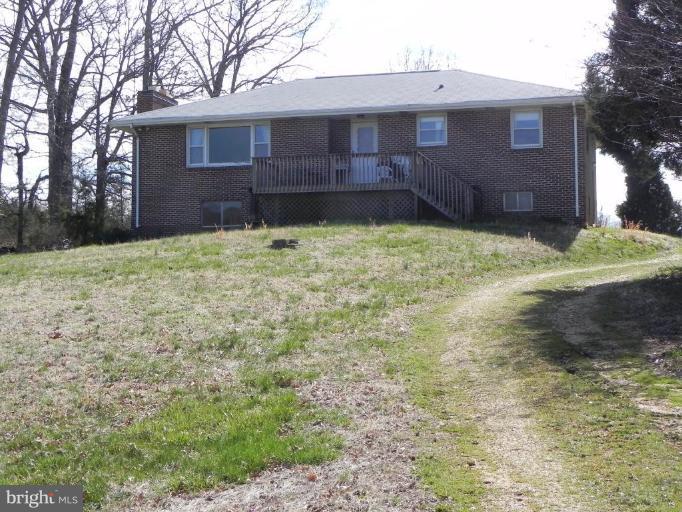 Working Hay farm 54 acres of mostly cleared land appx 14 acres wooded, with a 3 bedroom 2 bath brick home with full basement. Large Metal building with run in shed attached. Amish Shed approx 30X12. Older Gazeebo and barn behind house. Home needs some updating but livable. Two parcels24 & 30 acres. No covenants, no easements. Great for large horse farm or growing crops. Deer and turkeys everywhere