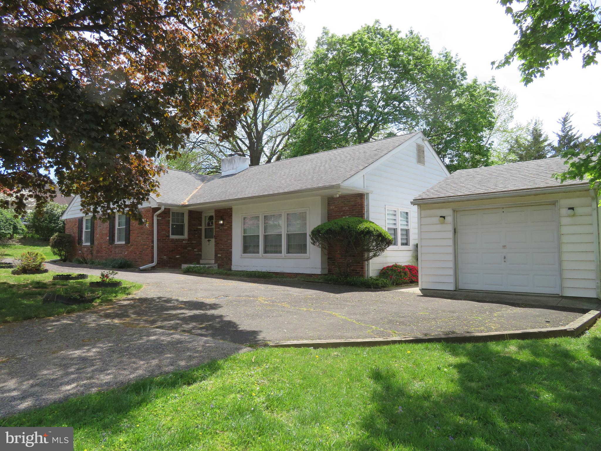 Welcome to this lovingly maintained 3-bedroom, 2-bathroom detached Brick Ranch — a perfect opportunity to make a home truly your own! Step into the welcoming wood-floored entry foyer that opens into a spacious living room filled with natural light from large windows and deep sills. The open layout flows seamlessly into the dining room, perfect for entertaining.  The kitchen features wood cabinetry, gas cooking, updated LTV flooring, a convenient laundry closet, and direct access to the rear yard and garage area. Just off the kitchen, step up into a cozy family room with a charming brick wood-burning fireplace, a generous closet, and sliding doors leading to an enclosed sunroom and a beautiful backyard—ideal for year-round enjoyment.  The primary bedroom offers a large closet and a private ceramic tile bath with a shower stall. Two additional bedrooms, including one with dual closets, share a full ceramic tile hall bathroom with a tub/shower combo.  The full basement is a true bonus, featuring two large finished areas—perfect for a game room, home gym, or media space—and a massive unfinished area with endless possibilities for storage or future expansion.  Recent updates include new windows, a new roof, and a newer HVAC system. Location is everything! Just steps from playgrounds and ball fields, and offering easy access to the train station, grocery stores, restaurants, gyms, and so much more. You’ll love the convenience and community feel this wonderful neighborhood provides.  With solid bones and thoughtful care over the years, this home is ready for your personal touch to make it shine!