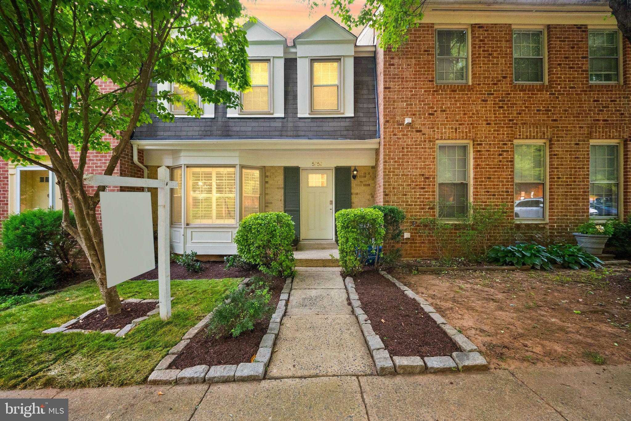 Welcome to 5752 Crownleigh Ct — a beautiful, light-filled 3-level townhome in Burke offering comfort, updates, and a fantastic location. Inside, you’ll find gorgeous wood floors on the main and upper levels, creating a warm and inviting feel throughout the home.
The main level features a spacious layout with an updated eat-in kitchen complete with stainless steel appliances, a large sink, quartz countertops, and plenty of space for everyday meals or entertaining. Just off the kitchen, step out to the deck overlooking trees, giving you a peaceful and private backdrop for morning coffee, grilling, or relaxing outdoors.
Upstairs, the huge primary bedroom offers great space, two generous closets, and an updated ensuite bath. Additional updates include new windows in 2012, HVAC in 2012, a new front door and shutters, and thoughtful improvements throughout.
The walk-out basement adds even more flexibility with new LVP flooring, a large rec room, a cozy wood-burning fireplace, a full bathroom, and tons of storage. Whether you need a second living space, home office, guest area, or playroom, this level gives you plenty of options.
Located close to the Burke VRE, shopping, and major commuter routes, and situated in the Lake Braddock Pyramid, this home offers both convenience and community. With two assigned parking spots and a move-in-ready feel, 5752 Crownleigh Ct is one you won’t want to miss.