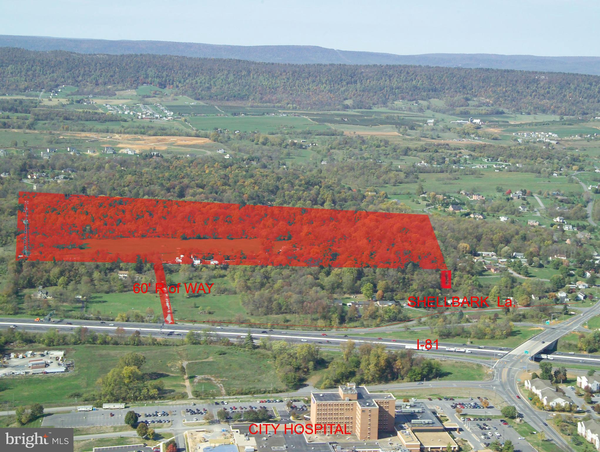 53+- acres +/- set back and entirely visible from I-81. Site is situated off of Exit 14, I-81 interchange;   University of WV  Hospital Exit and Dry Run Road Exit.  It is across I-81 from the University of WV hospital. Current access is via Shellbark Lane to Cabana Lane  (60' wide access point), other access possible.  Great property for residential, commercial or mixed use. Lots of recent development in this area notably big Proctor & Gamble manufacturing plant, multiple warehouse facilities (Amazon in Winchester). Adjacent to residential developments. Also several large residential  developments within 3 miles. Site is about 11 miles from the I-70/I-81 interchange in Maryland.  Easy access to down town Martinsburg, DC Commuter train, great commuter location.  

Property consists of three adjacent parcels. Additional lots 3.74 Acres Summit Drive priced at $137,500.
Lot 5 Shellbark, priced at $72,000.

This site has 100 feet of direct frontage on Shellbark Lane which is sufficient for utilization as an access point for intensive development of the site. An adjacent lot along Shellbark Lane which is also offered provides a second area of road frontage and a second access point for significant development. The property previously secured Sketch Plat approval  for intensive development which  demonstrates the residential development potential of this site. 
Appraisal available.
 PUBLIC WATER AND SEWER LINES AT PROPERTY BOUNDARY.