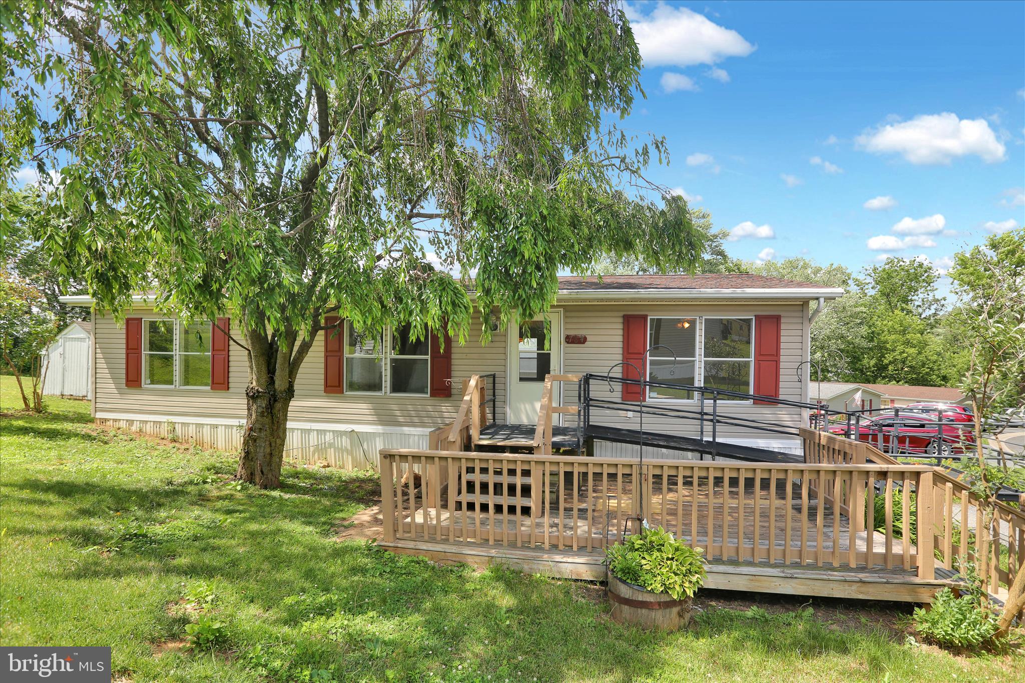 Welcome to Crestwood Community for all ages. This manufactured home has been well maintained and recently renovated. Three generous bedrooms and two full bathrooms with walk-in showers accommodate large and small households. The primary bedroom includes a walk-in closet. The kitchen is open plan to the dining area and living room. High ceilings in the living room afford plenty of space for the ceiling fan. New carpet and new paint throughout update this home to a clean, modern style. The hot water tank was replaced last December and the furnace is only a few years old. The propane tanks are leased, which can be transferred to the new owner for economical propane heat and gas cooking. The front deck is shaded by a mature tree on the south side of the house. This home is move-in ready!