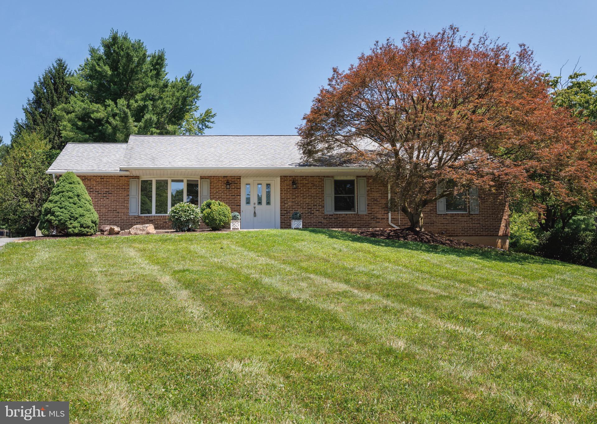 Welcome home to this charming 4-bedroom, 2.5-bath brick ranch nestled on a beautifully landscaped 0.75-acre lot. Offering a warm, old-fashioned feel with spacious living areas, this home is full of timeless character and comfort. Hardwood floors flow throughout much of the main level, including the dining room, where beautiful wood flooring was installed just five years ago. The kitchen offers ample cabinetry and generous workspace for everyday living and entertaining, while 3-foot-wide halls and doorways provide added handicap accessibility throughout the home. The inviting family room is centered around a classic brick fireplace, creating the perfect place to gather. Large windows and French-style patio doors fill the home with natural light and provide easy access to the expansive backyard and deck. Step outside to enjoy the peaceful setting with mature trees, manicured landscaping, a spacious deck that's only one year old, and a matching one-year-old storage shed, ideal for outdoor equipment, hobbies, or extra storage. Additional updates include a water heater that is less than one year old, offering added peace of mind. Combining thoughtful updates, accessibility features, and the space and charm of country living with everyday convenience, this well-maintained home is ready for its next chapter. Schedule your showing today!