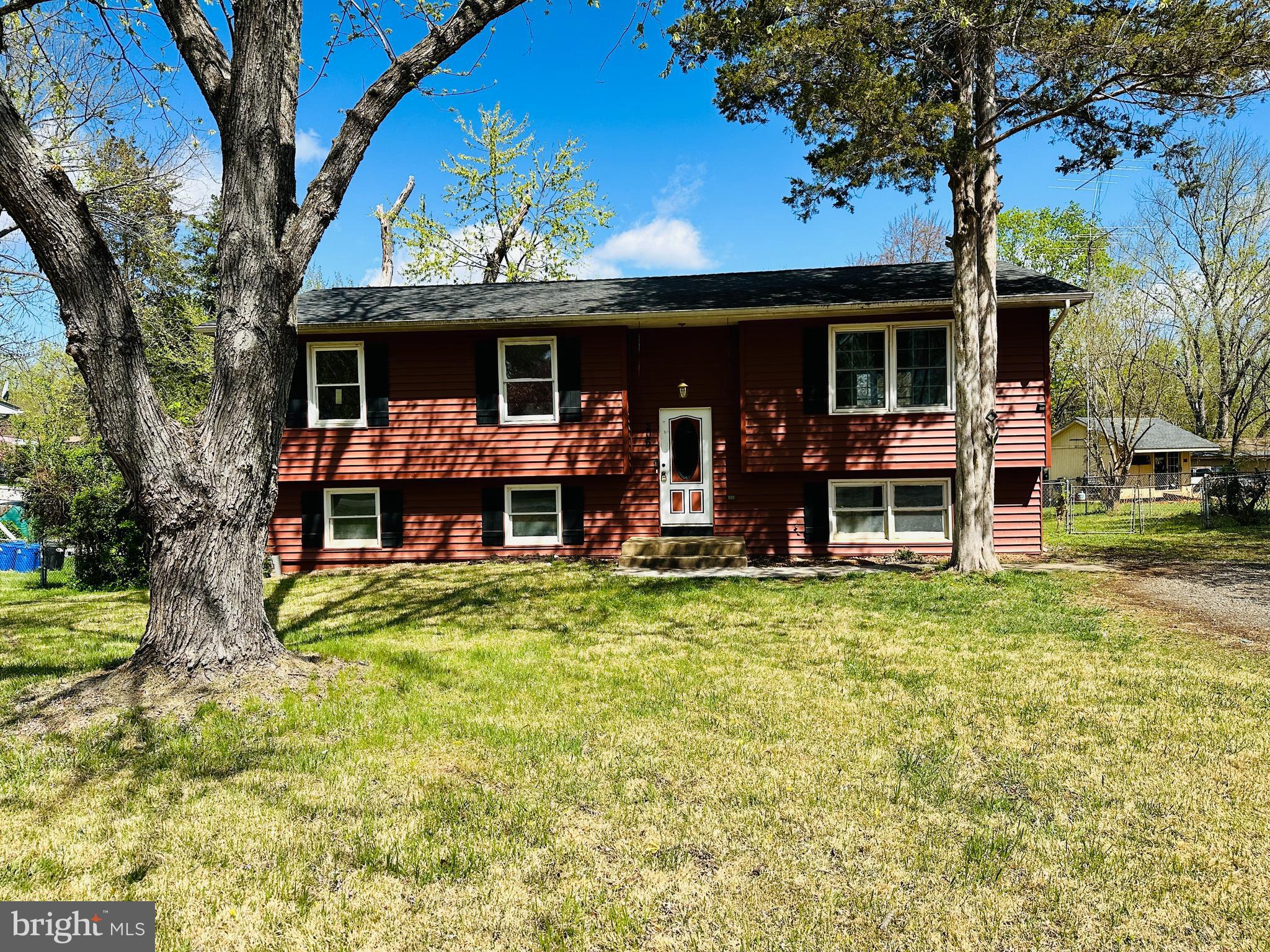 ***Highest and Best by mid night Sunday 4/13 and offers will be presented Monday afternoon*** Bring your paint and tools and make this home your own! This spacious 2-level home features 4 bedrooms and 3 full bathrooms, situated on a flat, fully fenced backyard with a large parking area. Conveniently located just minutes from major highways and shopping centers. The home boasts several recent updates, including newer siding, roof, and some windows. The exterior HVAC unit is about a year old, and the water heater is also newer. The upper level offers a kitchen, dining area, 3 bedrooms, and 2 full bathrooms. The finished basement includes an additional bedroom, a full bathroom, a laundry room, and a large rec room that walks out to a concrete patio and the fenced backyard—perfect for entertaining or relaxing outdoors. ***Seller has an active real estate license in VA***