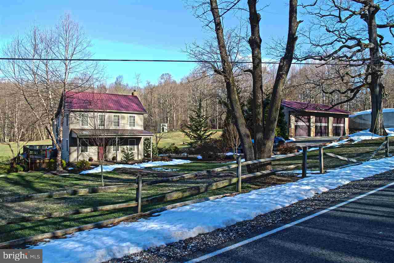 Restored farmhome for sale on 5.59 acres of land! Features include a large eat-in kitchen with an 8ft island, stainless steel appliances, & plenty of counter & cabinet space. Separate dining area. Heated tile floor in the bathroom. Convenient 1st floor laundry. A wraparound deck looks out over the gorgeous backyard. 30x50 pole building w/ 12" doors. Appliances included in the sale. Charming details throughout home make this a must see!