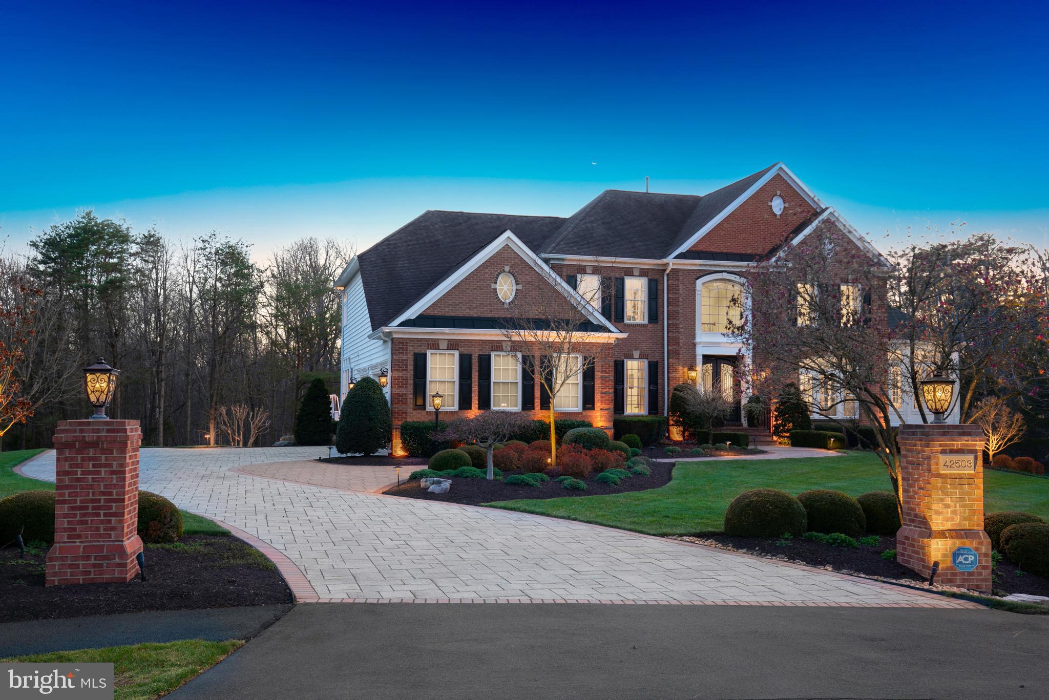 Welcome to an exquisite oasis nestled within the prestigious Estates at Cedar Crest. Discover the epitome of luxury living on 4.31 acres of prime real estate, boasting unparalleled tranquility on a cul-de-sac lot bordered by lush trees.

Step into a world of refined elegance where outdoor entertaining meets sophisticated design. This stunning property features a plethora of outdoor living spaces, including an expansive Trex deck ideal for al fresco dining and relaxation, a covered terrace adorned with ceiling fans, and a patio with a gas firepit and an outdoor kitchen crafted for culinary excellence.

Indulge in the outdoor kitchen's amenities, featuring a professional-grade Woodstone pizza oven, a 38” gas grille, and a U-Line beverage fridge. Gather around the custom-engineered fiberglass-reinforced concrete table, comfortably seating twelve, or retreat to the Bluestone firepit with steel logs, meticulously designed for warmth and ambiance.

The exterior exudes opulence with a Techo-Bloc paver driveway, professional outdoor lighting, and an irrigation system maintaining the pristine yard. A convenient shed offers storage for seasonal outdoor items.

Step inside to discover a masterful blend of craftsmanship and luxury. The main level boasts wood-look Atlas Concord and Ital Graniti porcelain tile flooring, a sweeping staircase with wrought-iron spindles in the two-story foyer, and a sunlit conservatory overlooking the serene woods. Entertain guests in the formal dining and living rooms, or retreat to the cozy family room with a stone gas fireplace and butler's pantry equipped with a dual-zone Perlick beverage fridge.

For the culinary enthusiast, the chef's dream kitchen awaits, equipped with true Quarzite counters, Wood Mode cabinetry with distressed mirror panels and intricate five-piece molding, top-of-the-line appliances including a Blue Star six-burner gas range with real chef's cast burners for easy cleanup, a Travertine hood covering the Faber exhaust fan, Wolf microwave, oven, and warming drawer, and a Subzero refrigerator. The adjacent sunroom seamlessly connects indoor and outdoor living, leading to the expansive deck.

Ascend to the upper level, where solid red oak hardwood floors flow from the hallway landing into the luxurious primary bedroom suite with its own sitting room and lavish en suite bathroom with a soaking tub, separate shower, and dual vanities. Three additional bedrooms offer versatility, including one en suite and two bedrooms serviced by a jack-and-jill style bathroom, each bedroom with its private vanity.

The lower level boasts entertainment at its finest, featuring a speak-easy style entry door, wine storage room for 480 bottles crafted with Philippine mahogany wood, a wet bar with a three-tier LED-lit liquor bottle display, cabinetry with touch lighting, 2 U-Line beverage fridges, a dishwasher, sink with disposal, handmade bar stools from California, and custom-fit + designed built-in seating creating an at-home tasting room ambiance. The home theatre with tiered seating for eight, 110” Stewart fixed screen, HD projector, 7 built-in speakers and 2 subwoofers, and popcorn machine create the perfect movie viewing experience. Stay active in the home gym with mirrored walls.

Additional outstanding features include the three-car side-load garage showcasing Poly Aspartic flooring and 15’ ceilings. New Carrier Infinity HVAC system units with air handlers for each of the three zones, a new 75-gallon State water heater, and radon mitigation system ensure comfort and safety. Custom solid-core doors, Baldwin hardware, and Hunter Douglas blinds add the finishing touches to this impeccable residence.

Experience unparalleled luxury living at the Estates at Cedar Crest – where every detail is meticulously curated for the discerning homeowner. Schedule your private tour today and elevate your lifestyle to new heights.