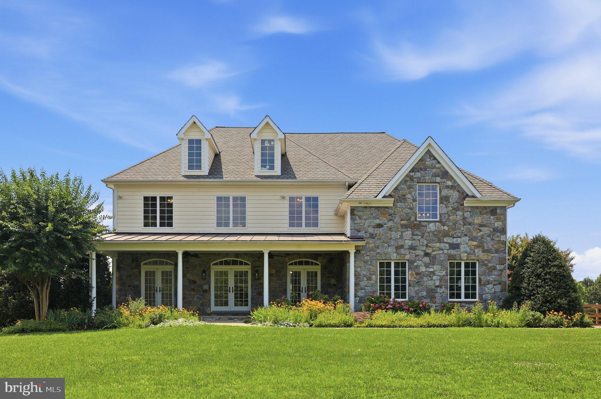 Available Now! Amazing oasis just outside of Poolesville, MD in the heart of the Agricultural Reserve. Bucolic views abound from every window of this custom home featuring over 7000 square feet of living space, HUGE inground swimming pool and flagstone patio surround, rear deck, full front porch, outdoor basketball/tennis court with lights, two-story board and batten barn with finished upper-level doubles as storage and entertainment space (indoor basketball/sport court ready!) all situated on over 12 acres within mere minutes of downtown Poolesville and top-rated Poolesville High School! Prime location, freshly painted throughout, refinished hardwoods throughout, professionally landscaped. A MUST SEE!