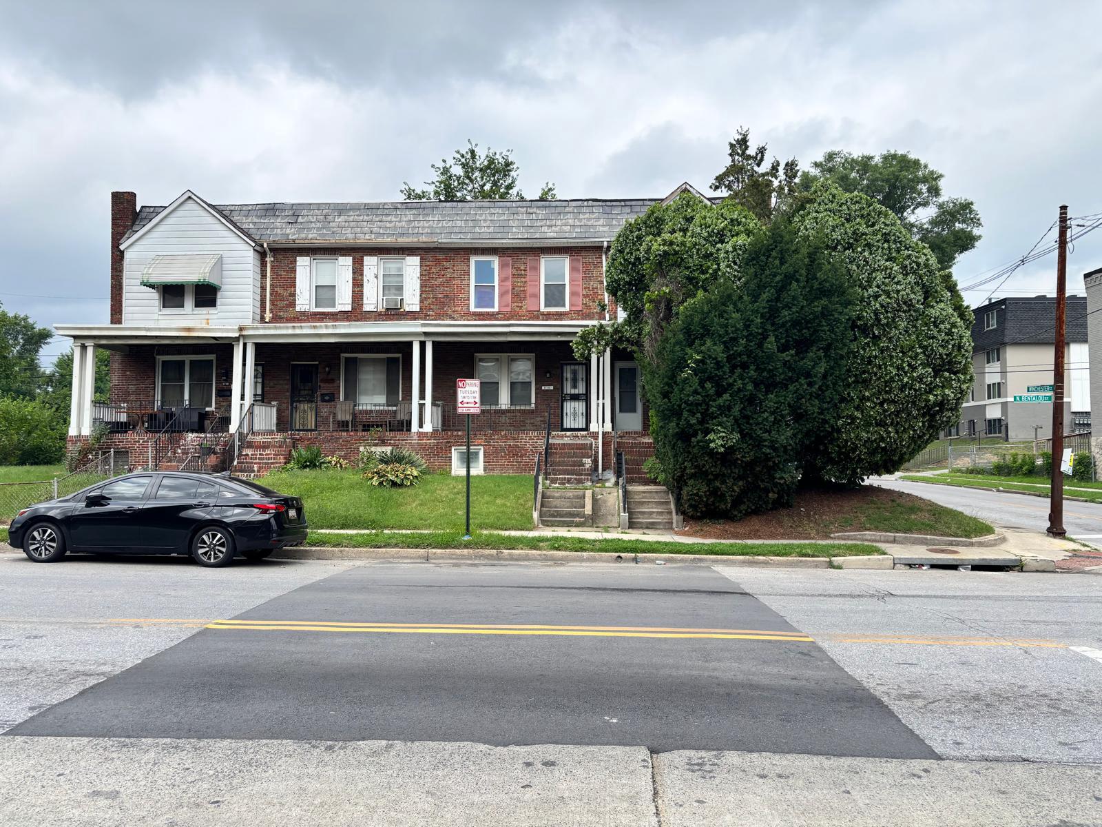 Excellent opportunity to restore and add value to this classic end-of-group brick townhouse featuring 3 bedrooms, 3 full bathrooms, and approximately 1,530 square feet of living space. The main level includes a spacious living room, separate dining room, and a full bathroom with a stand-up shower. The upper level offers three bedrooms and a full bathroom with a tub/shower combination, while the partially finished lower level includes an additional full bathroom with a walk-in shower and outside access. Hardwood flooring, an existing stair chair lift (which conveys), and a flexible floor plan provide an excellent foundation for renovation and customization. The home has been improved over the years; however, it is being sold strictly AS-IS and will likely require additional interior and exterior repairs. Ideal for investors or buyers looking to build equity through renovation. Ground rent is $90 annually.