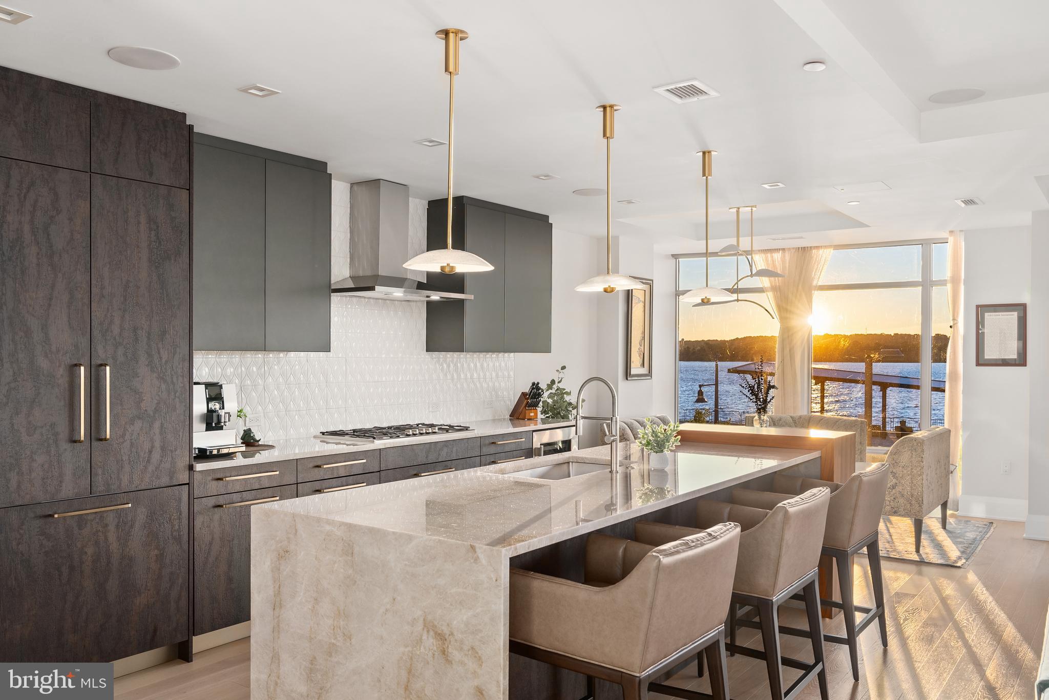 Luxurious riverfront condominium located in Robinson Landing in Old Town Alexandria. This 2-bedroom PLUS den, 2.5 bath unit has panoramic views of the Potomac River. Wake up to beautiful sunrises every morning and enjoy a warm cup of coffee from the luxurious kitchen featuring Snaidero cabinetry, top-of-the-line appliances and quartz center island. Outfitted with the best finishes throughout, spacious living areas, floor-to-ceiling windows with remote-controlled blinds, 2 garage spaces and storage unit. Located along Old Town's vibrant waterfront and just 2 blocks to the shops and restaurants of King Street, Robinson Landing offers concierge service, 24-hour on-site staff, fitness center, yoga studio, pet grooming spa, bicycle storage and workshop, elegant lobby, game room and resident lounge with Potomac River views. Work out in the building's gym while looking over the Potomac River, then grab a coffee at the one of the restaurants located on the promenade in front of the building. Take a stroll along the waterfront, dine on the pier, shop at the Farmers Market or enjoy a multitude of activities available in Old Town. Convenient to Reagan National Airport, Amazon's HQ2, Capitol Hill, the White House and all metro D.C. has to offer.