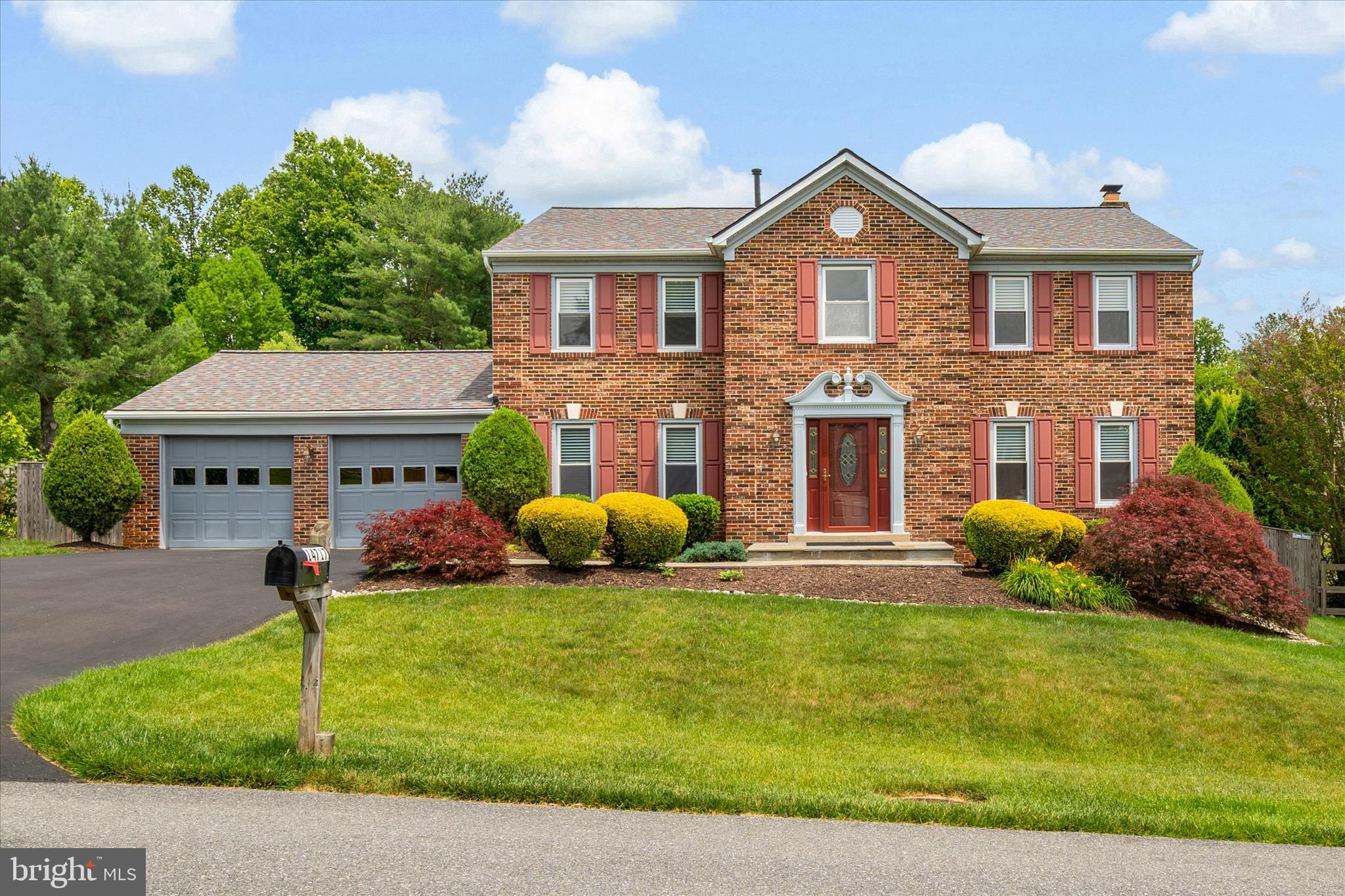 Welcome to this absolutely pristine and impeccably maintained colonial in the sought-after Fairland Acres community of Silver Spring. The sellers have made incredibly tasteful updates and renovations while maintaining the timeless charm.  As you approach, you immediately notice the brand NEW architectural shingled roof and brick-front. As you enter, you are greeted by refinished hardwood floors flowing throughout the entire home, setting an elegant tone from the moment you step into the two-story foyer. The main level is designed for both everyday living and effortless entertaining, offering a front living room, a second open-concept family room area that flows seamlessly into the kitchen. There is ample storage, cabinetry and stainless-steel appliances, rounding out this chef's kitchen. Additional main level features include a formal dining area, main-level laundry, and a convenient half bath. The eat-in kitchen area flows beautifully to your rear flagstone patio. Upstairs, you will find four generously sized bedrooms including a completely updated primary suite. The primary suite has a luxurious ensuite bath, with elegant soaking tub, doble vanity, glass enclosed shower and skylight. Three additional bedrooms with hardwood floors are flanked by an additional full bath that has been improved with new vanity, mirror and light fixture.  The unfinished basement presents a fantastic opportunity to add equity and customize additional living or flex space to your vision. Step outside to a large backyard with a patio off the kitchen, storage shed, and a two-car attached garage, rounding out all the space you need inside and out. Additional peace-of-mind features include a brand-new roof just two months old and a whole-house water filtration system. Ideally situated just minutes from Route 29 and MD-200/ICC for an effortless commute into Washington D.C., with Fairland Regional Park, Maydale Conservation Park, and the scenic Paint Branch Stream trails all close by. This one truly has it all - don't miss it!