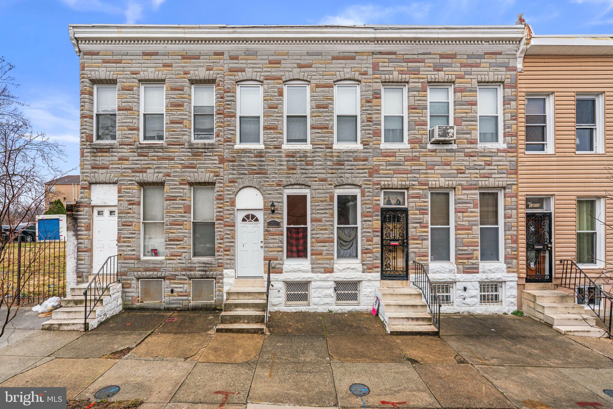 Welcome to this beautifully updated, move-in-ready townhome offering exceptional value in the vibrant Oliver neighborhood! Bathed in natural light and accented by recessed lighting, this 3-bedroom, 1.5-bath gem perfectly blends historic charm with modern convenience. Gleaming hardwood floors flow seamlessly through the living and dining rooms, continuing upstairs through the hallway and all three bedrooms. You will love the architectural character of the two decorative fireplaces, each featuring stunning antique mantel surrounds. The renovated kitchen is sure to impress with stainless steel appliances, a gas stove, gorgeous quartz countertops, and a stylish backsplash. A convenient half-bath completes the main floor, while a full bath serves the upper level. Step outside to enjoy your own private fenced-in backyard. The unfinished lower level provides a fantastic blank canvas, bursting with potential to easily add future living space. Don't miss this incredible opportunity—schedule your tour today!