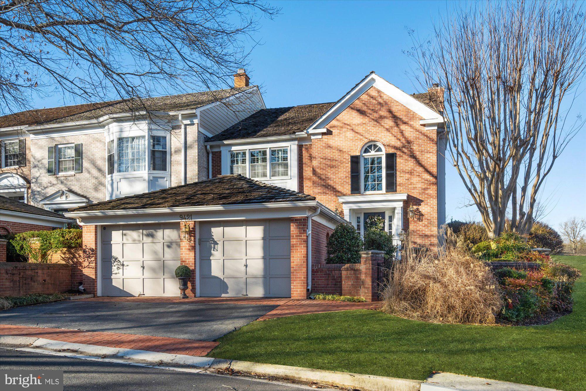 Introducing 9421 Turnberry Drive, a stunning turnkey townhome in the highly coveted Avenel community. Perfectly positioned on a premier corner lot, this home offers views of the renowned TPC Potomac golf course. Avenel’s resort-style amenities include tennis and pickleball courts, pools, security patrol, and professional landscaping. The Avenel park features a playground, athletic courts, and open fields for recreation.
A two-car garage with a rear door provides convenient access. Step inside to a grand two-story foyer with a striking sunlit window wall—just the first of many impressive features. The expanded kitchen flows seamlessly into a serene brick courtyard, creating an ideal space for private indoor-outdoor living and entertaining. A home generator is included.
This expansive home offers the perfect blend of luxury and functionality. With 3 bedrooms,  3.5 baths, and a main-level office, it’s designed for a dynamic live-work-play lifestyle.
Upstairs, the second level features two bedrooms and a luxurious primary suite. You may never want to leave this retreat, which boasts a vaulted ceiling, two walk-in closets, and a spa-like en-suite bath. Step onto the covered balcony, complete with built-in heaters, for a peaceful morning coffee or an evening unwind. A spiral staircase leads directly to the main-level brick courtyard, offering seamless indoor-outdoor flow.
The lower level is equally impressive, featuring a cozy fireplace and a full bath.
Just steps from your front door, you’ll find a manicured putting green and convenient guest parking. The nearby C&O Canal Historic Park offers miles of scenic trails for biking, running, and walking. With easy access to I-495, downtown Bethesda, Washington, D.C., and major airports, this home offers an unbeatable combination of luxury, convenience, and natural beauty.