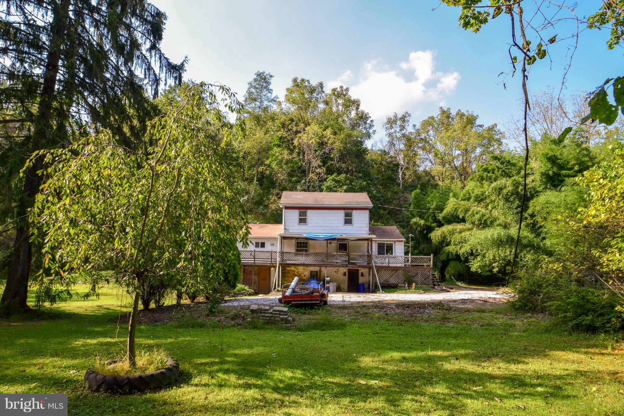 Attn: Nature Lovers!  Home sits on almost 4 wooded acres in Dallastown School District, and has a small stream going through it.  Property has abundant wildlife and is walking distance to Kain Park.  House needs significant work and is sold as-is.  Cash Buyers Only!
