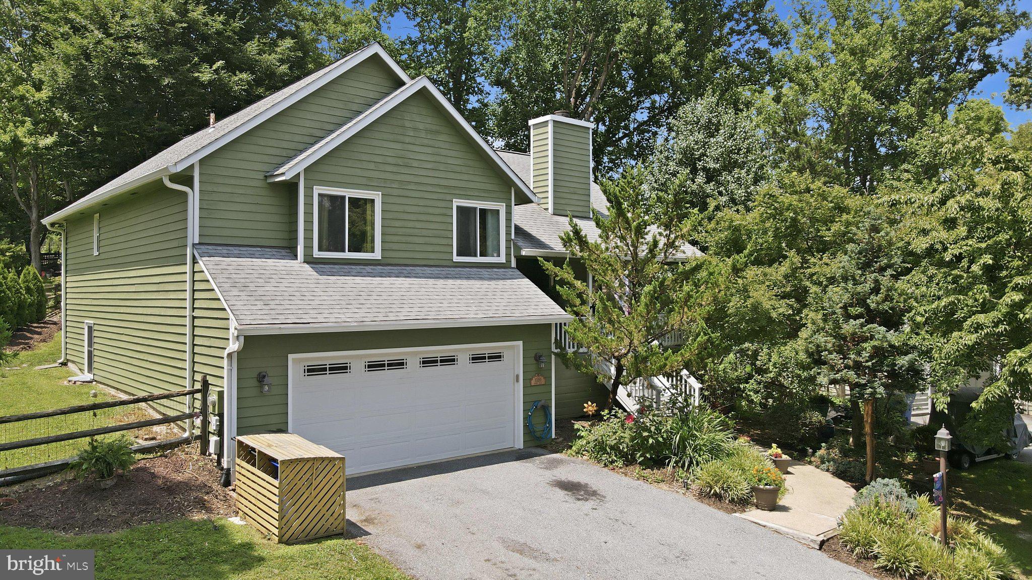Welcome to this beautifully maintained home in the highly desirable Lake Linganore Coldstream community. Professionally decorated and beautifully landscaped, this move-in-ready home has been thoughtfully updated, so you can simply unpack and start enjoying the exceptional lifestyle this award-winning community offers.

Inside, you'll find warm hardwood floors and new carpet in the bedrooms (July 2026) throughout the main level, fresh interior paint (July 2026), a stunning stone fireplace, and an updated kitchen featuring new stainless steel appliances, extended granite countertops, and a wine fridge (2022). The main-level bathroom was beautifully renovated in 2020 with stylish, modern finishes.

The spacious walk-out lower level offers exceptional flexibility, featuring a fourth bedroom that can easily serve as a family room, recreation room, home office, or guest suite. In addition, the unfinished walk-out basement provides outstanding potential to be easily finished, creating even more living space to fit your needs—whether you envision a media room, home gym, playroom, or additional guest accommodations.

Step outside to the freshly painted front porch or unwind on the custom patio (2023), complete with a fire pit—perfect for entertaining family and friends or enjoying peaceful evenings at home.

The location is truly unbeatable! The community pool is just a 2-minute walk from your backyard, giving you all the benefits of resort-style living without the maintenance. Just steps away, you'll also find the community center, home to seasonal festivals, summer concerts, farmers' markets, and neighborhood events year-round. Pickleball courts, a playground, and a basketball court are located just outside your fenced backyard, while miles of scenic walking and hiking trails are only moments away. Lake Linganore's private lakes and beaches are approximately a 10-minute golf cart ride away, making it easy to spend your days swimming, kayaking, fishing, boating, or simply relaxing by the water.

This is more than just a beautiful home—it's a lifestyle. Enjoy everything Lake Linganore has to offer, including multiple pools, private lakes and beaches, miles of trails, sports courts, playgrounds, year-round community events, top-rated schools, and convenient access to shopping, dining, and major commuter routes.
