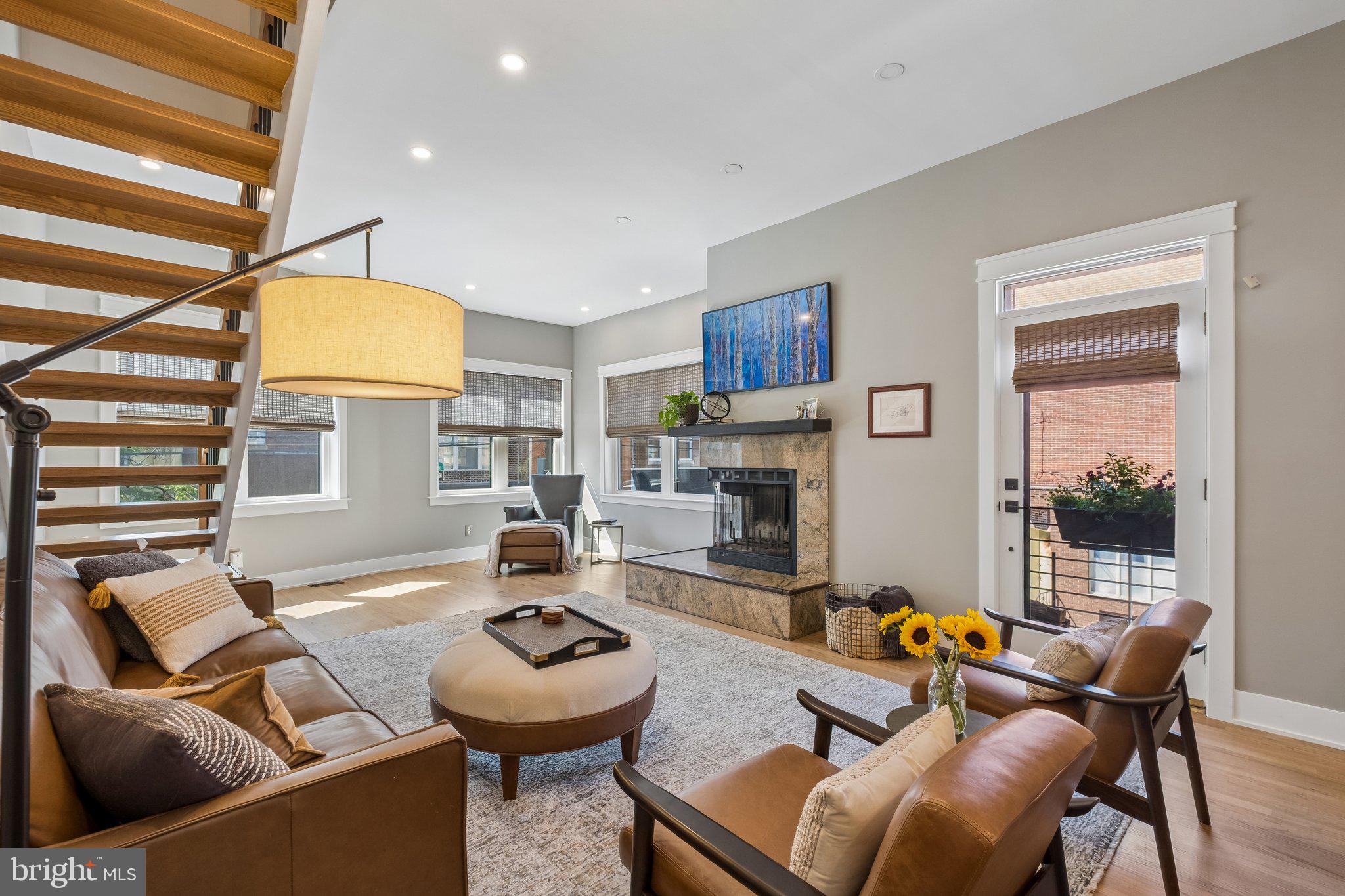 Rare Bella Vista corner residence at 8th and Catharine Streets with attached off-street parking, direct views of Palumbo Park, architect-designed plans for a future roof deck, and a recently completed custom-designed kitchen renovation—an exceptional combination of features rarely found in one of Philadelphia's most sought-after neighborhoods.

Filled with natural light from oversized windows and enhanced by its prominent corner location, the home offers expansive living spaces designed for both comfortable everyday living and effortless entertaining. At its heart is a stunning new custom kitchen featuring premium finishes, abundant storage, and thoughtful functionality, seamlessly connecting to the home's inviting gathering spaces.

Beyond its beautiful interiors, the property has benefited from substantial recent investments, including new James Hardie siding, custom windows, a new roof, a recently replaced HVAC system, new kitchen appliances, a new washer and dryer, and custom window treatments throughout, including motorized shades in select rooms.

The primary suite provides a peaceful retreat with custom built-in storage and a well-appointed bath with natural light. Two additional bedrooms offer flexibility for family, guests, or a dedicated home office, including a private ground-floor guest suite with its own en-suite bathroom. A finished basement adds valuable bonus living space for recreation, fitness, work, or media use.

Perfectly positioned across from Palumbo Park and just steps from the Italian Market, neighborhood cafés, acclaimed restaurants, and Center City conveniences, 801 S. 8th Street offers a rare opportunity to enjoy spacious city living with attached parking, extensive recent upgrades, and future roof deck potential in the heart of Bella Vista.