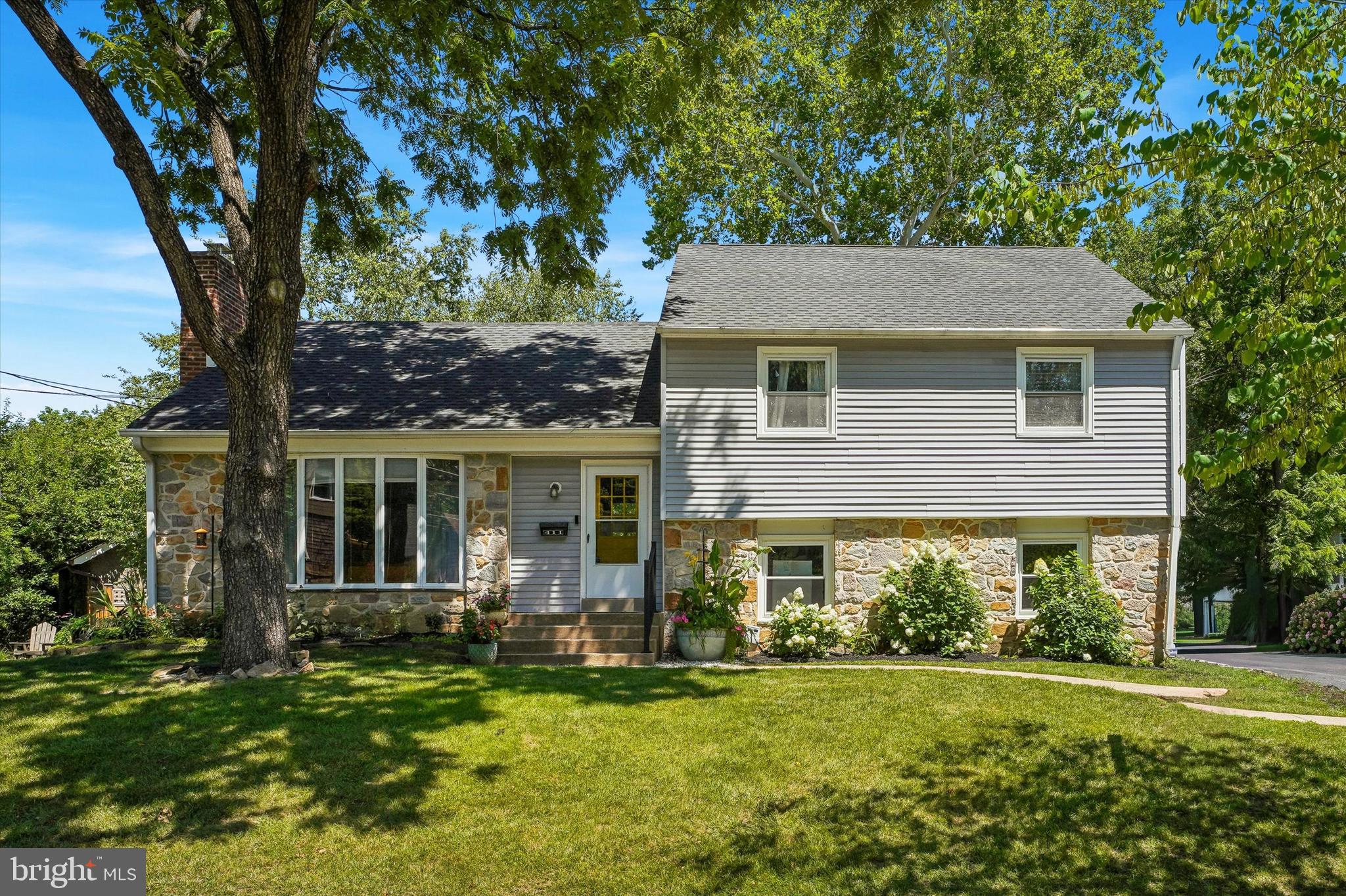 Welcome to 411 Drexel Place, where timeless charm meets modern convenience in the heart of the magical town of Swarthmore. Step inside to find a cozy sunken living room with an inviting fireplace and bay windows followed by a fully renovated and open-concept kitchen/dining area and breakfast bar that overflows into the built-in kitchen storage area of your dreams. With stainless steel updated appliances, beautiful tile work, and an abundance of natural light flowing through oversized windows entertaining here is a MUST.

Being a split-level, take the half flight of stairs down to a spacious bedroom/office space/or den.  A convenient laundry area with powder room leads you outside to your private seating, enclosed patio area and out back to your beautifully landscaped, lush & spacious fenced in backyard. Exit out the other side of the bottom floor to your 1 car garage as well!

Up the stairs retreat to your primary suite + ensuite or two other bedrooms with a full renovated bath complete with a jacuzzi tub. Continue up yet another set of stairs to your extra large fourth bedroom and then up once more to an oversized second living room/den/play room/at-home-gym or bedroom. The house truly goes on & on...

Situated within the award-winning Wallingford-Swarthmore School District and just moments from the vibrant shops and local favorites of the Swarthmore community, this home offers a perfect blend of style and accessibility. It’s more than just a house; it’s a place to truly call home.

Updates by current Sellers include:
Complete kitchen/dining room renovation, Full hallway bathroom renovation,  and Attic insulated and finished into a versatile bonus/playroom, New roof installed with gutter guards & more - all outlined in the attached improvements list

Professional Photos being taken today and uploaded ASAP