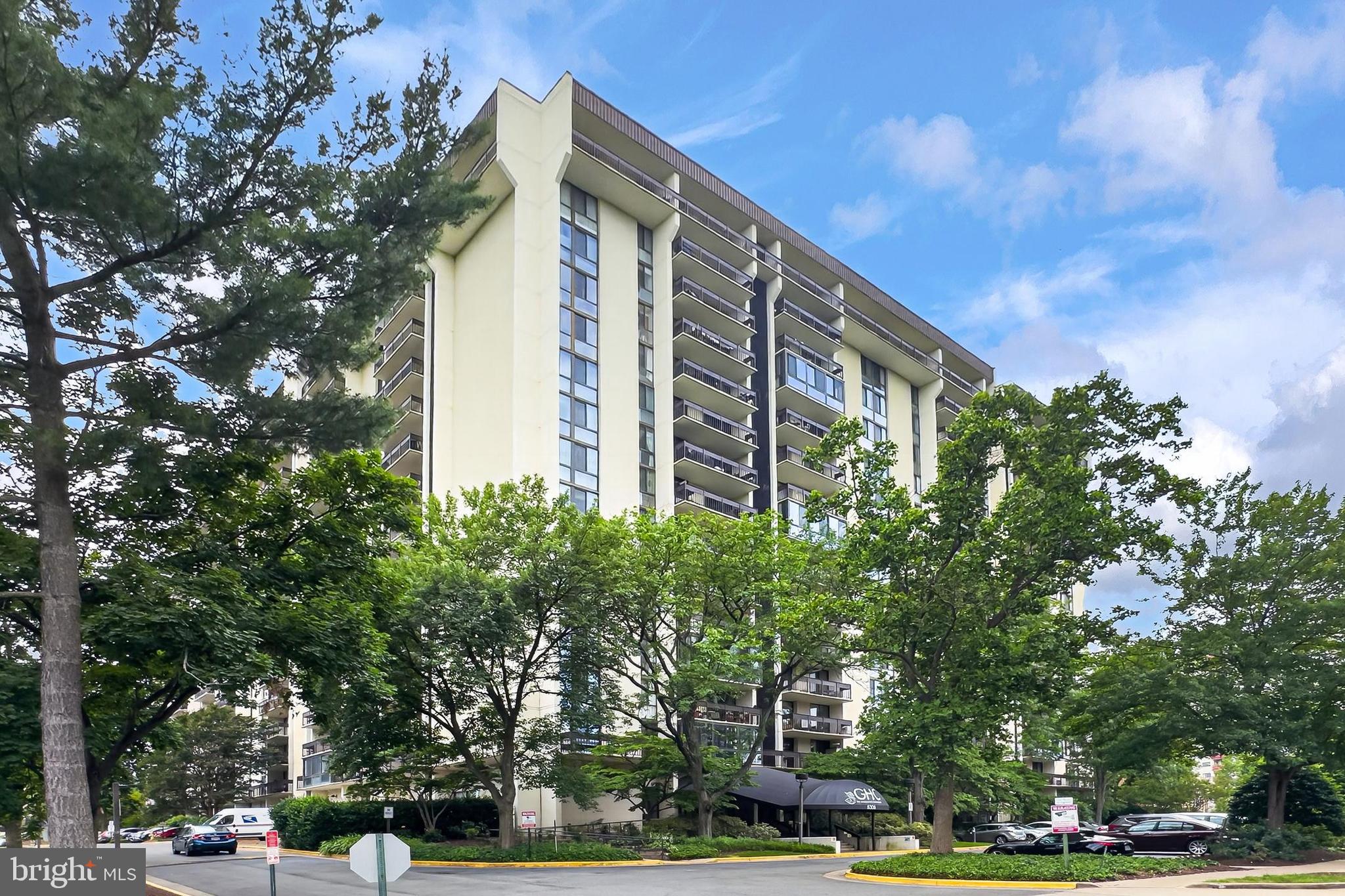 Welcome home to this beautifully updated 2 bedroom/2 full bath condo at the Greenhouse.  Special features include warm wood floors, fresh neutral paint, updated bathrooms and kitchen with stylish tile, custom cabinetry and countertops. The large balcony, facing north with beautiful treed and creek views, makes for perfect outdoor dining and entertaining. Convenient full sized stacked laundry, newly installed HVAC (2026) on site storage and garage parking add to this perfect package.  Greenhouse is known for its resort style amenities including a concierge, swimming pool, sport courts, work out room, community garden and gazebo. Perfectly located next to the new Alexandria Inova hospital and town center, surrounded by direct commuting routes into Old Town, Reagan National, The Pentagon and Washington DC.