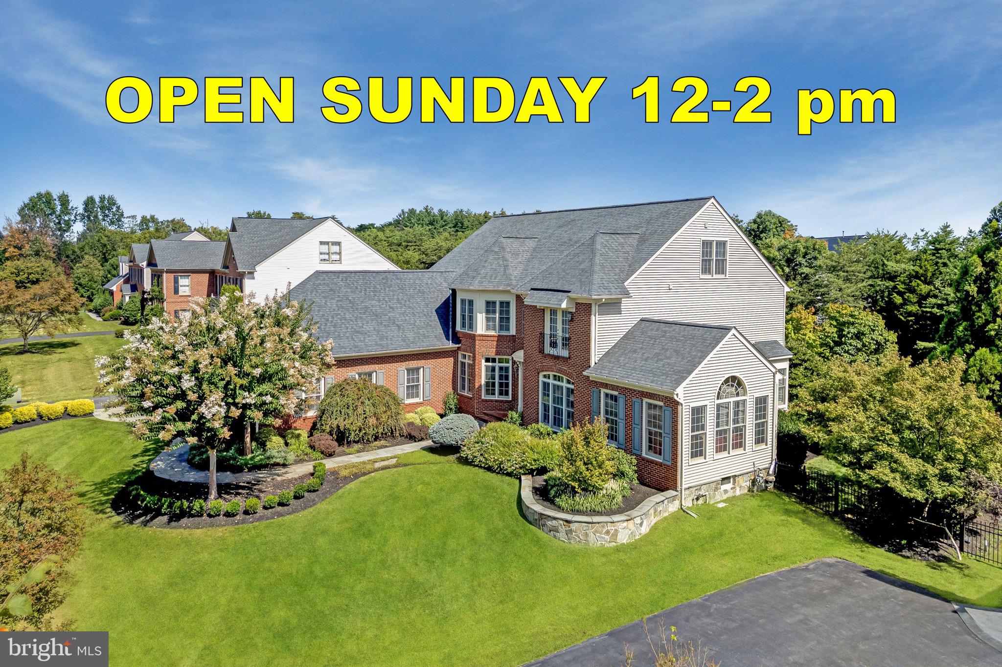 An extraordinary offering in one of Loudoun County's most desirable communities, this customized Craftmark estate delivers more than 7,500 square feet of luxury living across four finished levels. From the exceptional club-level entertainment space and rarely available finished attic retreat to the resort-inspired outdoor living areas, every detail has been thoughtfully designed for both grand entertaining and everyday living. Combining timeless elegance, extensive recent upgrades, mature landscaping, and an unbeatable location less than one mile from Metro, this is a truly rare opportunity.
<br><br>
Privately sited behind mature trees and professionally landscaped grounds, the backyard was designed as a personal resort. An expansive composite deck overlooks lush lawns and gardens, while the custom stone patio features a built-in grilling station, outdoor bar, firepit gathering area, extensive hardscaping, and beautifully terraced retaining walls. Whether entertaining dozens of guests or enjoying a quiet evening outdoors, the setting is both impressive and inviting.
<br><br>
Inside, a grand two-story foyer welcomes you with elegant columns, detailed millwork, and abundant natural light. Formal living and dining rooms provide timeless entertaining spaces, while the spacious family room, anchored by a gas fireplace and expansive windows overlooking the backyard, creates the heart of the home. A dedicated home office with custom built-ins offers an ideal work-from-home environment, while the sunroom addition with soaring cathedral ceilings and dramatic atrium windows provides a peaceful retreat.
The gourmet kitchen has been beautifully updated with brand-new professional-grade appliances, quartz countertops, subway tile backsplash, abundant cabinetry, a generous center island, and an adjoining breakfast room designed for everyday gathering. A custom mudroom adds exceptional organization and convenience.
<br><br>
Upstairs, the luxurious owner's suite offers a true private retreat featuring hardwood flooring, a spacious sitting room with beverage center, oversized walk-in closets, and a spa-inspired bath with separate quartz vanities, jetted soaking tub, frameless glass shower with dual shower heads, and built-in bench seating. Three additional bedrooms include one private en-suite and two sharing a beautifully updated bath, all featuring walk-in closets and upgraded finishes.
<br><br>
One of the home's most distinctive features is the finished fourth-level retreat. Rarely found in the area, this flexible space includes a guest bedroom, full bath, and expansive recreation area ideal for gaming, media, hobbies, studying, multigenerational living, or extended guests.
<br><br>
The walkout club level rivals those found in custom luxury homes, featuring an extraordinary custom entertainment bar complete with rich cabinetry, multiple beverage refrigerators, dishwasher, ice maker, generous seating, and designer finishes. Additional recreation areas, an exercise room, full bath, and private guest suite with walk-in closet create endless flexibility for entertaining and overnight guests.
<br><br>
Technology and infrastructure are equally impressive. A professionally designed whole-house multimedia system provides seamless control of televisions and audio throughout the home and outdoor living spaces. All televisions and multimedia equipment convey, while a commercial-grade Wi-Fi system delivers exceptional connectivity across all four finished levels and the backyard. Significant recent improvements include brand-new HVAC systems, a new water heater, and a premium 50-year architectural roof, providing years of peace of mind.
<br><br>
Located less than one mile from the Silver Line Metro, Dulles Toll Road, shopping, dining, and major commuter routes, this remarkable estate offers an exceptional combination of luxury, convenience, lifestyle, and value that would be difficult—and far more expensive—to replicate through new construction.