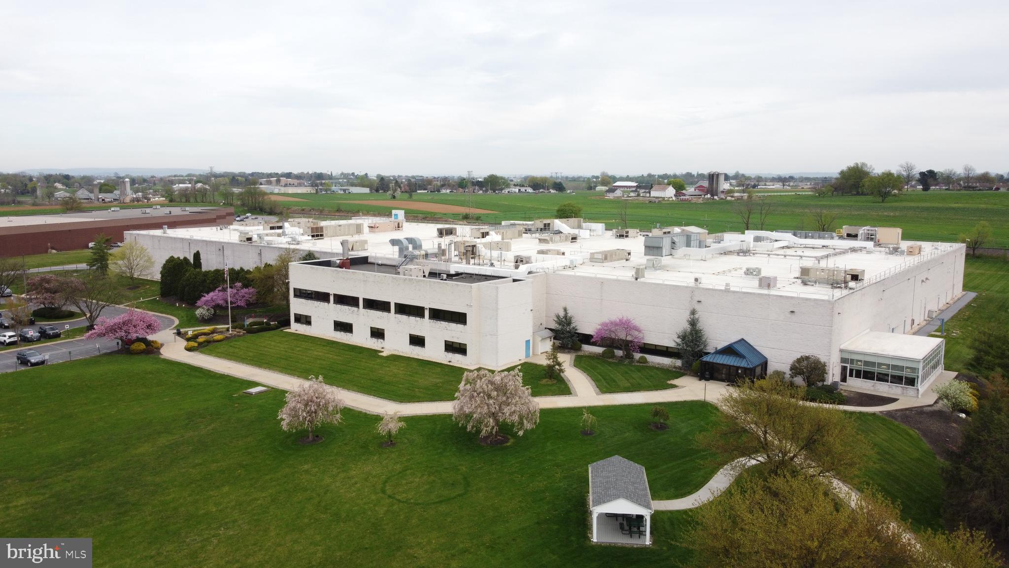 Amazing open the floorplan and new mechanicals.   This amazing manufacturing facility is located on 22 acres of rolling green lawns ideal for industrial production and warehouse and distribution.  $9.75NNN. Featuring all new roof, wide-open layout, new sprinkler, HVAC and lighting. The building has 1 elevator, 8+ loading docks, 1 drive-in and 24' ceilings. On-site parking for 322+/- vehicles. Potential for building expansion in the future.  Can be served by rail. 140,066 +/- SF.  Heavy power. If you had visited before... this is worth another look!