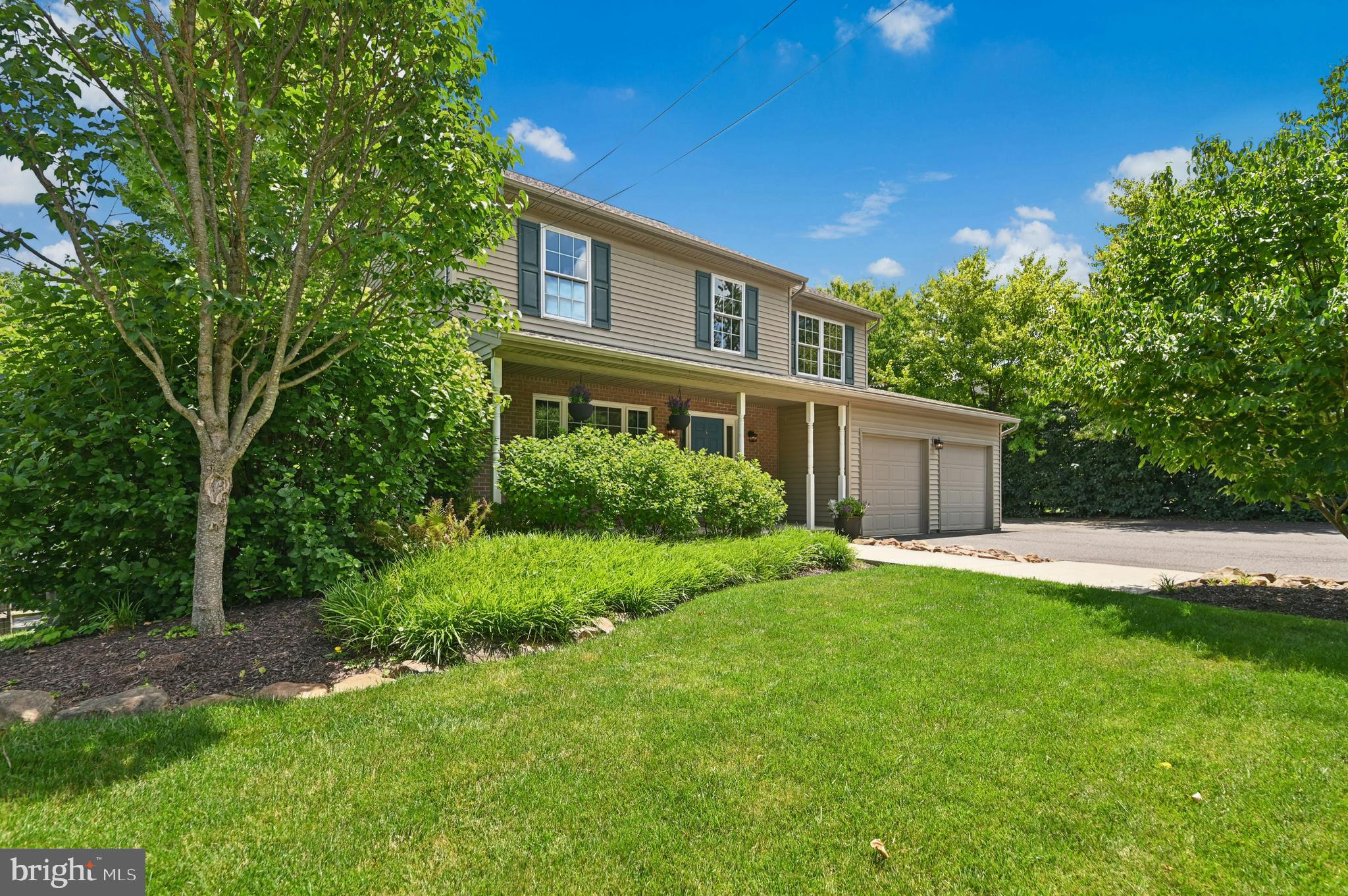 Set on a beautifully landscaped quarter-acre lot in the desirable Saucon Valley School District,  Parkside on Old Philadelphia offers lovingly maintained and updated colonial style with inviting indoor and outdoor living spaces. This four-bedroom, two-and-a-half-bath home features a two-car attached garage, a fully fenced yard, and thoughtful exterior spaces designed for everyday enjoyment and effortless entertaining.
Inside, the custom maple eat-in kitchen serves as the heart of the home, complete with granite countertops, a center island with seating, and a comfortable layout for gathering, cooking, and conversation. Direct access to the new Trex deck extends the living space outdoors, overlooking the beautifully maintained grounds, brick paver patio, and glorious hardscaping and landscaping.
The home’s traditional floor plan provides room to live, work, host, and unwind, while the full walk-out basement offers excellent potential for additional finished space, storage, recreation, or future expansion. Close to commuter routes, restaurants, shopping, colleges and universities, and beloved Lehigh Valley event venues, this home offers comfort, convenience, and classic curb appeal in a beautifully connected location.