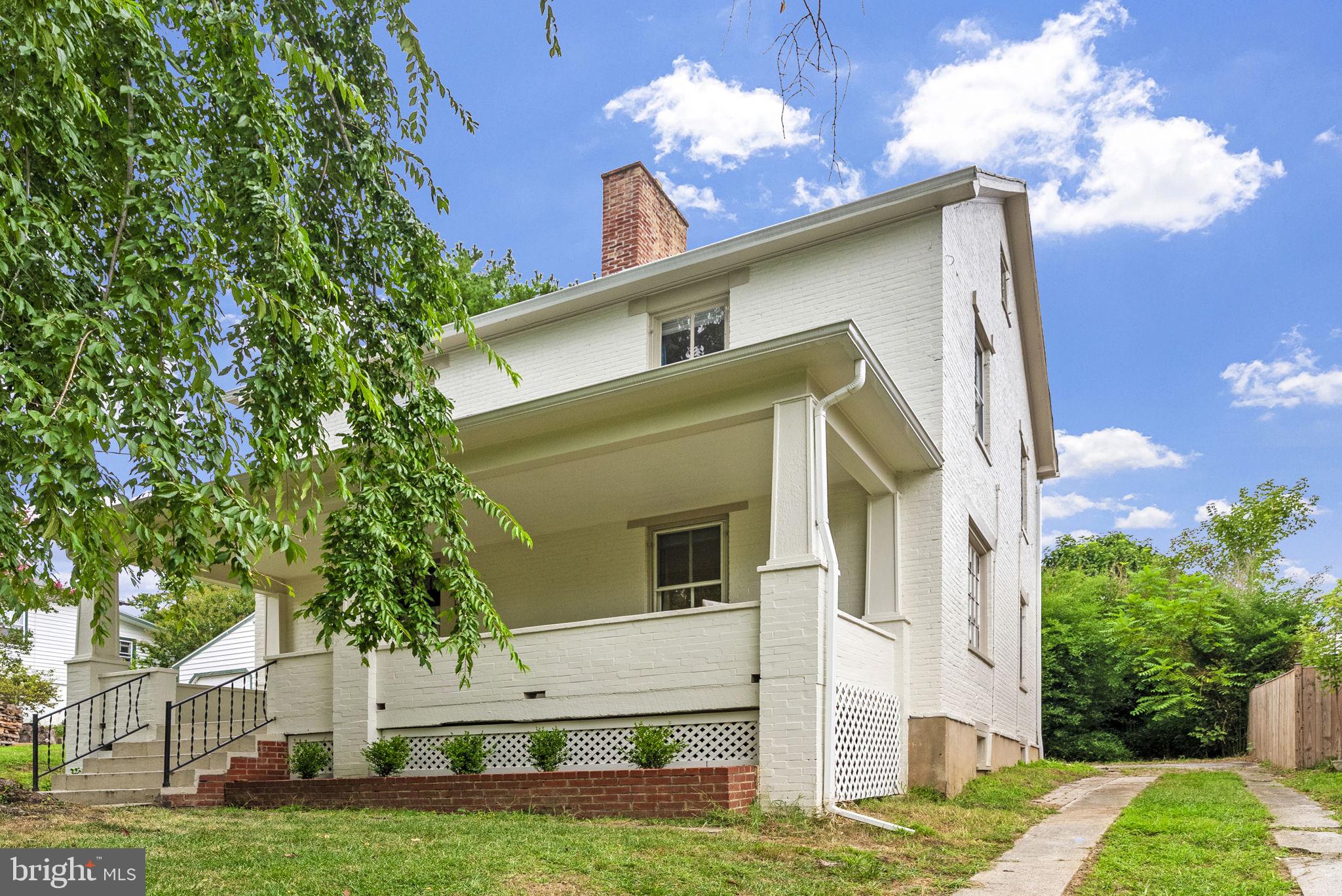 Proudly located in the storied town of Harpers Ferry, this distinguished circa-1859 Armory residence presents a rare opportunity to own a true piece of American heritage. Once the home of Phillip Burkhart, a documented armorer, and formerly owned by the U.S. Government, this stately brick property exemplifies the craftsmanship and character of a bygone era—seamlessly blended with modern comfort.

The residence retains numerous original architectural details, including intricate moldings, tall ranked bays with two-over-two double-hung sash windows, and an interior brick chimney. A broad, inviting front porch welcomes you into the side hallway-style home, radiating both historic charm and timeless elegance.

Featuring five bedrooms, two full bathrooms, and a spacious finished attic, the home has been carefully updated to preserve its historic integrity. At the rear of the property, an attached carriage house—complete with its own private entrance. A charming potting shed/greenhouse adds further character and functionality to the grounds. Recent upgrades include a fully repainted and repointed brick exterior, two new HVAC systems for year-round comfort, and new flooring throughout the main level.

Ideally situated in one of West Virginia’s most scenic and culturally rich locales, this property is just a short stroll from the vibrant streets of downtown Harpers Ferry, where you’ll find boutiques, dining, and historic landmarks. Outdoor enthusiasts will enjoy immediate access to world-class hiking on the Appalachian Trail and biking along the C&O Canal Towpath—both within walking distance of this immaculate home. For commuters, the MARC train station is a short walk with direct service to Washington, D.C., offering the perfect blend of small-town serenity and urban convenience.