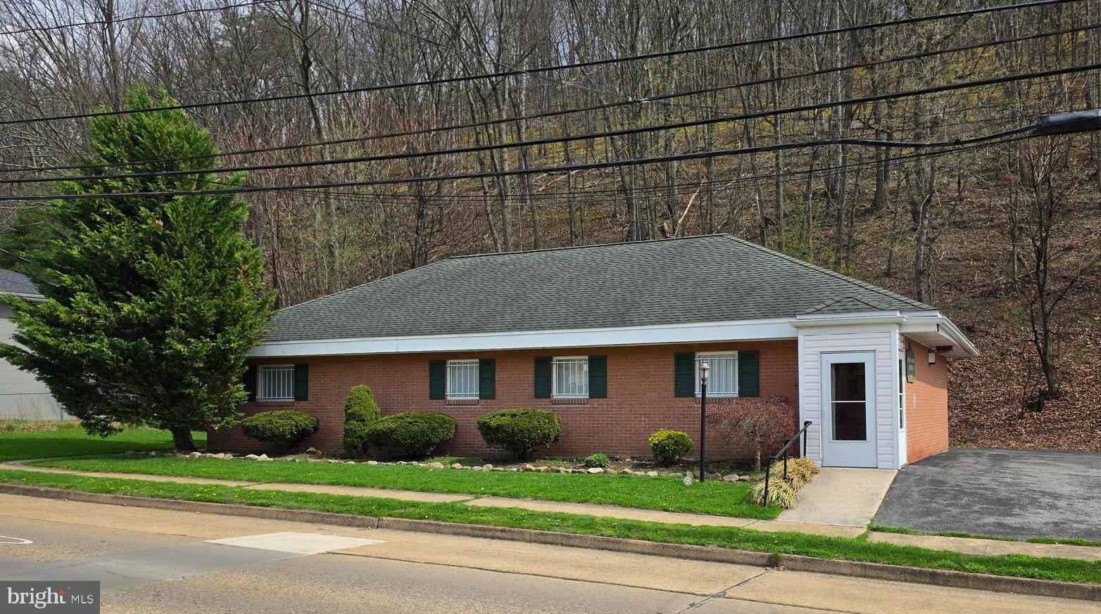 Professional office building in a convenient location with ample on-site parking. This well-designed space includes a welcoming reception area, four private offices or patient rooms, a conference room, and three restrooms. Offering approximately 2,100 square feet, the property was previously used for medical purposes but is suitable for a variety of business uses. Currently vacant and ready for immediate occupancy—an excellent opportunity for your next venture.