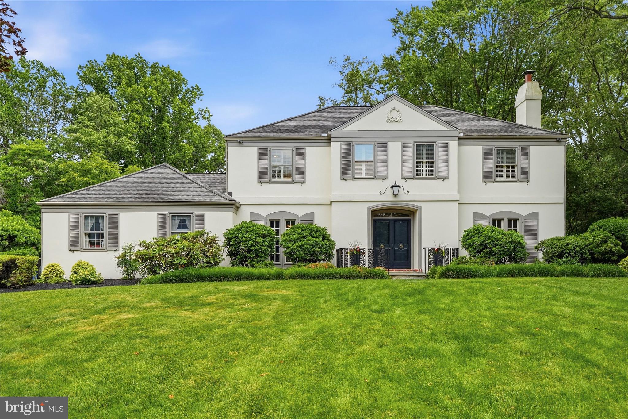 Welcome to 736 Governor Circle, a stunning French Colonial on a serene cul-de-sac in Radnor Township. Set on a lush .75-acre lot, this home offers over 3,000 square feet of thoughtfully designed living space where classic elegance and modern comforts mesh in perfect harmony.
Step inside to find hardwood floors that flow throughout the entire home. The main level is anchored by a spacious, light-filled living room featuring a cozy wood-burning fireplace—perfect for formal gatherings and hosting friends and family. The dedicated formal dining room provides a sophisticated backdrop for holiday meals and dinner parties. The kitchen offers a generous eat-in area for casual daily life, while the adjacent den serves as a quiet retreat complete with handsome built-in bookshelves and access to the backyard space. This floor is designed for ultimate convenience, featuring a laundry room/mud room combo, a full bathroom, and a powder room.
Upstairs, the primary suite is a true sanctuary, boasting a private bathroom and a spacious walk-in closet. Three additional guest bedrooms share a beautifully updated second-floor guest bathroom, ensuring a fresh and modern feel for everyone. Downstairs, the finished basement provides a dedicated lounge and TV space, ideal for movie nights or a secondary living area.
The backyard is an entertainer’s dream. Imagine hosting summer gatherings around the sparkling salt water pool, surrounded by professional landscaping that creates a private, park-like atmosphere. The exterior also features a level side yard and a convenient storage shed, offering plenty of room for outdoor activities and organization.  A bonus greenhouse  is a perfect compliment to anyone with a green thumb.  The two-car attached garage completes this exceptional property. This is a rare opportunity to own a home that perfectly balances grand entertaining spaces with everyday warmth.  
Located within minutes of West Chester Pike, 476 (the blue route),  and within award winning Radnor School District, this home should not be missed!