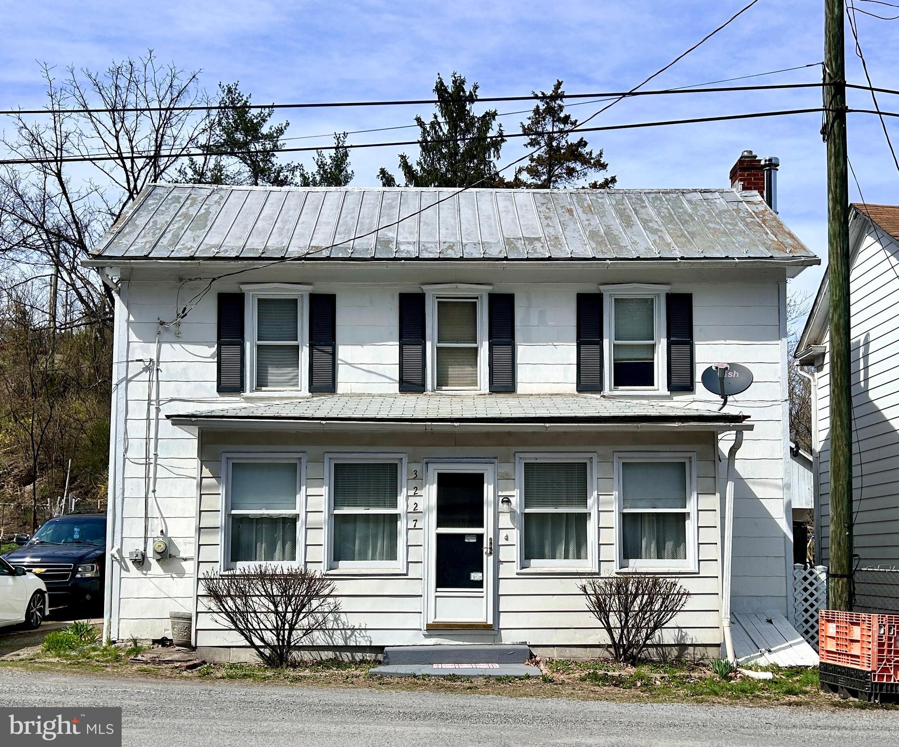 Step into a piece of history with this beautifully semi-restored 1900 farmhouse, a perfect blend of old-world charm and modern convenience.  With over 1,600 square feet, this 3 BR 2 1/2 BA home welcomes you with gorgeous hardwood flooring that runs throughout, adding warmth and character to every room.

Nestled on over 6/10 of an acre of unrestricted land, this property offers endless possibilities—whether you're dreaming of a hobby farm, a homestead, or simply a peaceful retreat. With multiple outbuildings, there’s plenty of space for storage, workshops, creative projects.  There's even an old chicken coop that could be utilized for cost-savings on eggs!  You'll love the oversized 2 car detached garage that offers many possibilities for auto enthusiasts, or for the hobbyist who likes to tinker around with projects.

For water enthusiasts, the location is unbeatable. A short five-minute walk takes you to the majestic Potomac River, where you can fish, swim, kayak, or launch your boat from the nearby boat ramp. Spend your mornings sipping coffee on the porch, your afternoons exploring the water, and your evenings enjoying the tranquility of country living.

The home itself features stainless steel appliances in a well-appointed kitchen, with built-ins, blending modern efficiency with timeless appeal. Whether you're looking for a full-time residence, a vacation getaway, or an investment with incredible potential, this property is a rare gem waiting to be discovered.

Come experience the charm, history, and adventure that await in this farmhouse that's ready for its new owner.  Schedule your showing today!