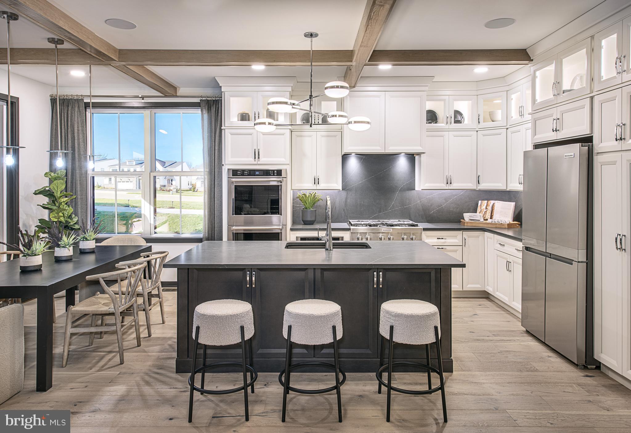 The Willis Elite offers luxury and comfort within a well designed floor plan. Enter through the foyer to a spacious, open-concept great room that overlooks a large casual dining area and elegant kitchen that features a large island with breakfast bar and abundant counter space. Guests can enjoy a bedroom and full bathroom on the main level as well. On the second floor, the elegant primary bedroom suite boasts an impressive walk-in closet and a primary bath featuring dual sinks, linen storage, and a private water closet. Adjacent, the secondary bedrooms are enhanced by walk-in closets and share a hall bath. The Willis Elite also features a versatile second-floor loft, a private office off the foyer, easily accessible laundry, a powder room, and plenty of additional storage. This home includes the Designer Appointed Features and is move-in ready!