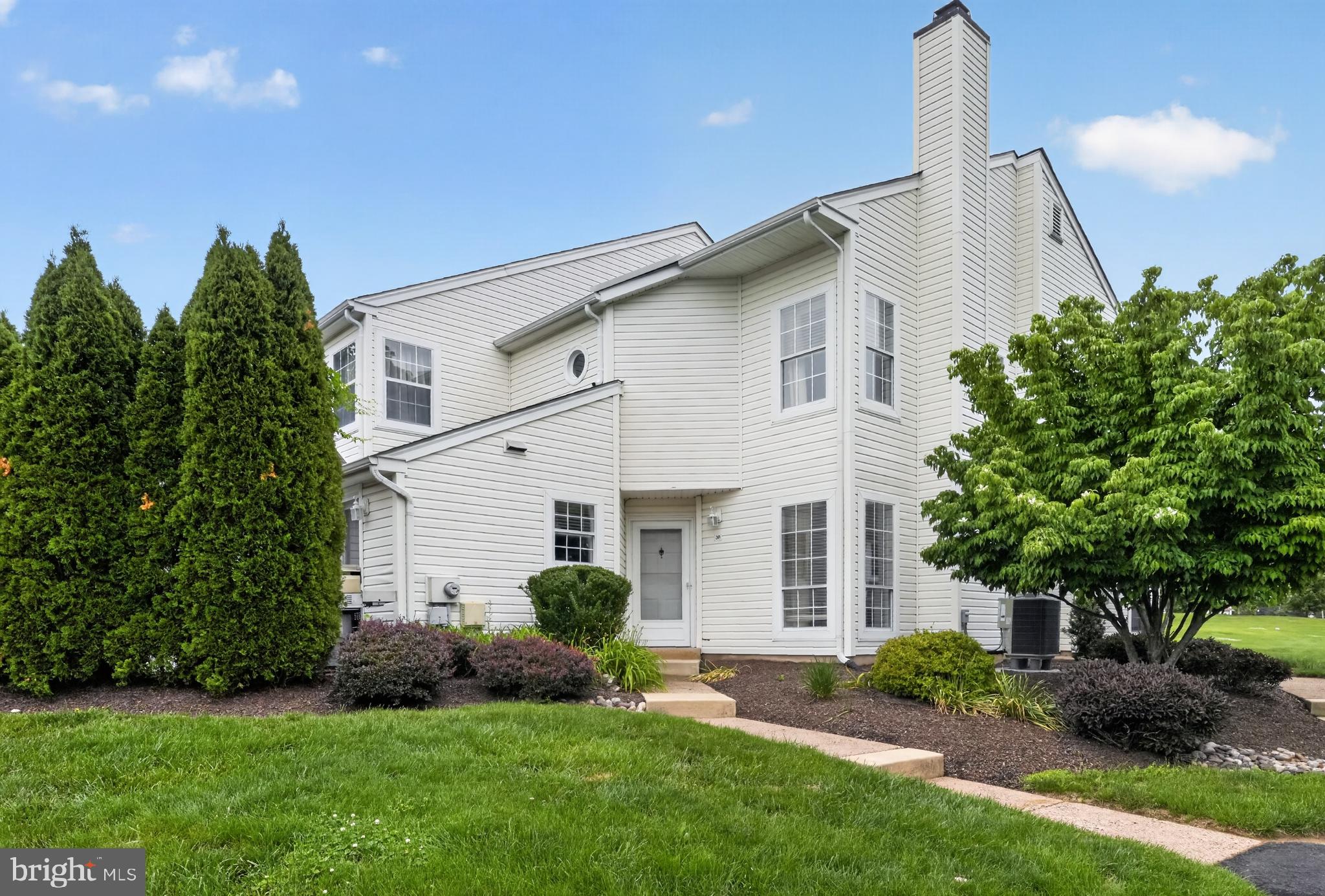 Welcome to this beautifully updated corner townhome in desirable Village Shires, offering privacy, modern finishes, and truly low-maintenance living. With extensive recent upgrades already completed - including a brand new roof - this move-in ready home offers both comfort and peace of mind.

The open-concept main level features new flooring throughout, wood stairs, updated lighting, and an abundance of natural light. The updated kitchen includes granite countertops, stainless steel appliances, and ample cabinetry, with sliding glass doors leading to a private patio enclosed by mature arborvitae for added seclusion. The adjoining living and dining areas are centered around a wood-burning fireplace, creating a comfortable and functional living space. A tastefully updated powder room featuring a sleek smart toilet and contemporary finishes completes the first floor.

Upstairs, the full bathroom has been completely renovated with stylish tilework, a new vanity, LED mirrors, a Woodbridge jacuzzi tub, and a modern smart toilet. The spacious primary bedroom features a professionally finished walk-in closet with custom organization. Additional high-end upgrades include solid European interior doors with modern hardware, fresh interior paint, a brand new washer and dryer, and a whole-house Leaf water filtration system.

Enjoy access to Village Shires community amenities including pools, tennis courts, and walking paths. The HOA provides a carefree lifestyle by covering landscaping, snow removal, trash, roof, and siding maintenance. This home is ideally located near Tyler State Park and the shopping and dining of Newtown Borough, with a seamless commute to Philadelphia, Princeton, or NYC via nearby major routes.