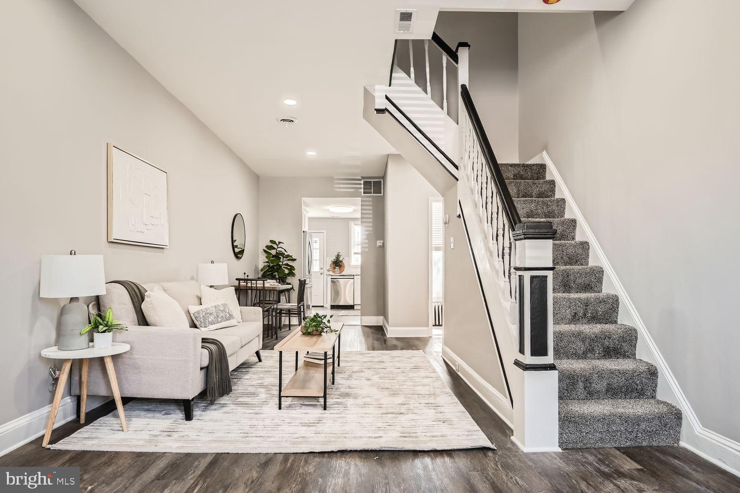 Welcome to 803 Wellington St., a beautifully updated home perfectly situated in the heart of Hampden—just steps from Chestnut Avenue and only a block from the renowned shops, restaurants, and nightlife of 36th Street, better known as “The Avenue.”  Blending modern upgrades with classic neighborhood charm, this thoughtfully renovated residence offers stylish finishes and comfortable living throughout. The main level features durable luxury vinyl plank flooring, fresh paint, and an open, inviting feel from the moment you walk in. A conveniently located updated powder room adds both functionality and contemporary style.  The kitchen has been tastefully redesigned to impress, showcasing granite countertops, stainless steel appliances, recessed lighting, dark tile flooring, and crisp white cabinetry paired with a timeless subway tile backsplash. Whether entertaining guests or enjoying a quiet evening at home, this space delivers both elegance and practicality.  Upstairs, plush carpeting creates a warm and comfortable atmosphere across three spacious bedrooms. The full bathroom has been modernized with updated finishes that complement the home’s overall aesthetic. Central air conditioning combined with radiator heat ensures year-round comfort in every season.  Additional highlights include a spacious basement ideal for storage, along with a rear deck and private backyard offering the perfect setting for outdoor dining, entertaining, or simply relaxing.  Located in one of Baltimore’s most vibrant and desirable communities, this home places you moments from local cafes, boutiques, parks, and entertainment while maintaining the charm and character Hampden is known for.  Don’t miss your opportunity to own a move-in ready home in an unbeatable location.