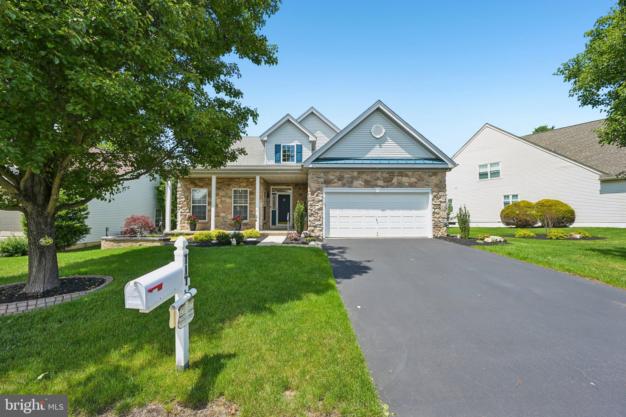 Welcome to effortless living in the highly sought-after 55+ community of Legacy Oaks. This beautifully updated home blends modern style with everyday comfort, offering a thoughtfully designed layout and high-end finishes throughout. From the moment you enter the open foyer with soaring cathedral ceilings, you’ll appreciate the seamless flow, luxury vinyl flooring, custom lighting, and a stunning statement chandelier that sets the tone for the home.

At the heart of the home is a showstopping, fully remodeled kitchen featuring premium KraftMaid cabinetry, natural quartz countertops with elegant gold accents and a striking waterfall edge, under-cabinet lighting, and a suite of GE Café and JennAir appliances. A spacious island with its own chandelier provides bar seating in two areas, while the sunny breakfast nook opens directly to the expanded deck—perfect for morning coffee or entertaining—with easy access to the community walking path. The kitchen flows effortlessly into the living and dining areas, creating an open and inviting space ideal for both everyday living and hosting.

The living room is anchored by a custom linear electric fireplace with designer tile and floating shelves, while the adjacent family room offers the warmth of a cozy gas fireplace and a dramatic cathedral ceiling that opens to the loft above, filling the space with natural light and an airy, expansive feel. The adjoining dining room provides even more room to entertain, and the home has been freshly painted throughout, including the finished basement, with recessed lighting enhancing every bedroom.

The main-level primary suite is a true retreat, featuring dual walk-in closets with custom organizers and a spacious en suite bath complete with a double vanity, jetted soaking tub, and separate shower. A second guest bedroom and an updated full hall bath are also on the main level, offering flexibility for guests or one-floor living. A convenient main-level laundry room with additional cabinetry adds to the home’s functionality.

Upstairs, a bright and airy loft overlooks the family room and kitchen below, creating a beautiful architectural connection between levels. This versatile space includes custom built-ins with a quartz countertop—perfect for a home office, yoga area, or additional lounge space. A third bedroom and another updated full bath complete the upper level, providing additional space for guests or extended stays.

The finished basement significantly expands your living space with plush Berber carpeting and a flexible layout that easily accommodates a home theater, fitness area, hobby space, or all three. Two large unfinished areas with built-in shelving provide exceptional storage, complemented by a two-car garage with additional built-ins for organization.

Outside, enjoy the charm of a covered front porch with stone accents and professionally landscaped grounds highlighted by a paver stone garden surround and thoughtful upgrades, including exterior soffit lighting and recent roofline improvements above the garage. The backyard offers a peaceful, private setting with an expansive deck and a park-like atmosphere. With additional updates such as newer windows, mechanical system enhancements, and new HVAC, this home delivers true peace of mind and low-maintenance living. Ideally located near Valley Square, Wegmans, and Whole Foods Market, along with a variety of restaurants, parks, and easy access to Route 611, everything you need is right at your fingertips.

Available for an early July closing—don’t miss the opportunity to enjoy exceptional living in one of Warrington’s most desirable active adult communities!