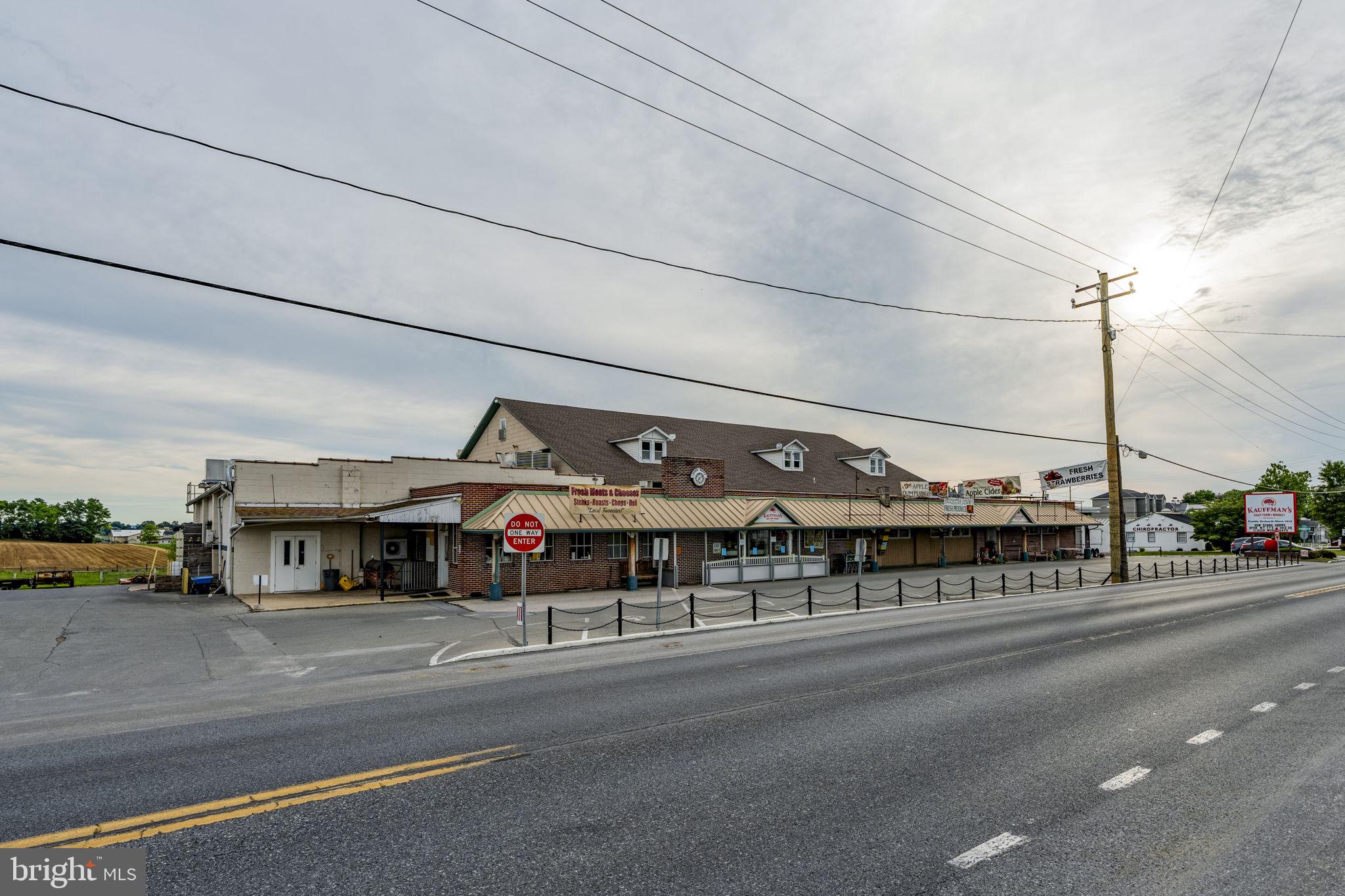 Rare Commercial Property. Outstanding HiTraffic location in high demand area in prime Amish Country. Featuring 2 separate deeded properties being sold as on package. The Main building offers 18690'Sq on the 1st floor plus 5140' on the 2nd level. Over 9800' sq of Cold Storage and Freezer space. Plus a free standing 3600 sq. Commercial building used for e-commerce, with offices and a mezzanine, and a 20' x 34' maintenance building provide additional options on the 2.5 acre property. Kauffman Fruit Market has served the community over 100 years and is currently operating as a food market and manufacturing Kauffman's prized Award winning Apple cider. The adjacent house included on a separate deed hosts multiple offices for the company, equipped with fiber optic internet. 3 phase electricity, public sewer, well water. 2 parcels being sold 3093 and 3097 Old Philadelphia Pike. Parcels 350-76298-0-0000 and 350-95208-0-0000. Seller is relocating all current operations to a new site 1/2 mile south of current location. Seller requires a lease back with an option for a period of up to 2 years from the date of settlement. Seller will lease back the 1st 12 months at $25000 triple net per month, plus pay all utilities. Second year lease back will be month to month with a 6 month advance notice to vacate. Second year lease rate shall be $26000 Triple net. No retail sale of bulk foods shall be permitted to operate by any new ownership. Seller is relocating all current operations to a new site 1/2 mile south of current location.
