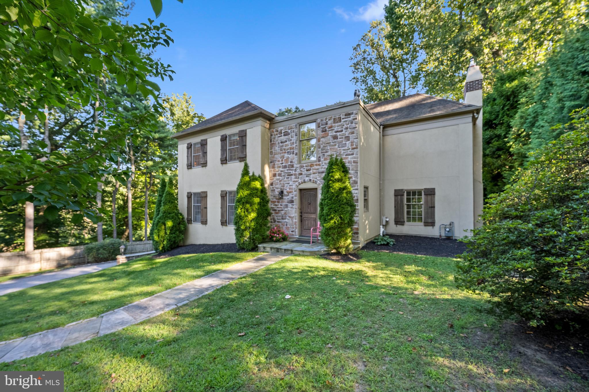 OPEN HOUSE CANCELLED - Fall in love with this charming, move-in ready French Colonial home in Northside Bryn Mawr! 431 Caversham Rd has been tastefully updated, boasts timeless features, and has a convenient layout for easy living and entertaining. Step in to the gracious foyer, which connects multiple generous and light-filled spaces that flow together perfectly. The large, window-lined living room connects to the dining room which features classic wainscoting and sliding door out to the flagstone patio. Nearby, the updated kitchen has top-of-the-line stainless steel appliances, white cabinets, and sleek black granite countertops. The kitchen’s ample space, large center island with seating for 3, and access to the patio make it the ideal space for entertaining all year round. The welcoming family room is the heart of the home, with a cozy gas fireplace, built-in shelves, and a charming window seat overlooking the manicured rear yard. A powder room rounds out the convenience and comfort of this floor. Upstairs, the primary suite is a tranquil escape from the hustle of every day. This room has a high tray ceiling, large closets and dressing area, and an updated ensuite bathroom with a double vanity and sizeable shower. On this floor there’s also plenty of space for family and friends, with three bright bedrooms all with large closets and a shared hall bath. The lower level closes out this multifaceted home with a laundry room, mud room, and tons of unfinished storage space to take advantage of. This level has access to the oversized attached 2-car garage. Outside, you’ll love spending time on lovely flagstone patio while the little ones and pets play in the fully fenced yard. Located in one of the most desirable neighborhoods in Bryn Mawr and near top rated Lower Merion Schools. Only minutes away from the shops, restaurants, and other conveniences Bryn Mawr has to offer.