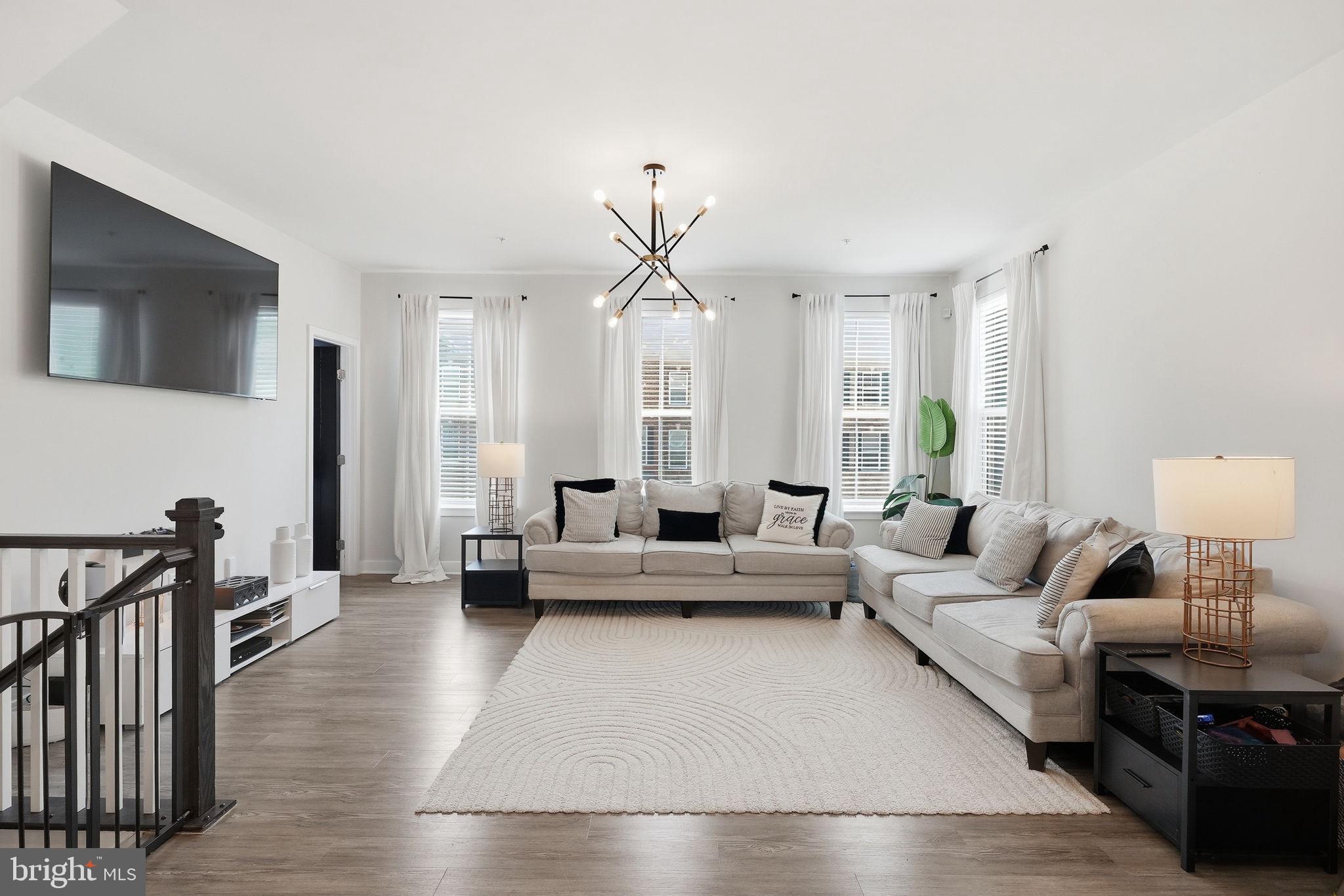 AGENTS - PLEASE VIEW AGENT REMARKS IN BRIGHT MLS. Some homes you have to grow into. This one just feels right from the second you step inside. This end-unit townhome packs 2,280 square feet into three finished levels. Walk in on the entry level and you've got a full rec room — flex space for whatever your life calls for. Up the wooden stairs, the main level opens into one flowing space for kitchen, dining, and living. The kitchen brings it — white cabinetry, quartz counters, gold hardware, and pendant lighting that ties it all together. Slide open the door off the kitchen onto a deck big enough for actual living. Upstairs holds all three bedrooms, including a primary suite with a double showerhead shower and custom built-out closets in every room making organizing a breeze. Laundry's up there too — no hauling it up and down stairs. Being the end unit means more light, more privacy, and a little extra breathing room. Add the two-car garage, plus a walkable neighborhood with a community pool, dog park, and playgrounds, all just minutes from Waldorf's shopping and restaurants — and this one's easy to picture yourself in. Some things just don't translate through photos. Come see it in person.

Offers may be entered ONLINE through Friday, July 24, 2026 at 1:00 pm.

AT SELLER'S DISCRETION, AN OFFER MAY BE ACCEPTED AT ANY TIME.