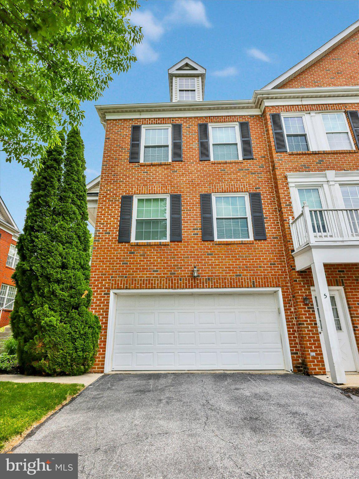 Semi-Detached/End Unit Townhouse with 3 bedrooms, 2 full and 2 half baths located in the gated community of Goldsborough Manor offers new roof and windows in 2023; primary bath redone in 2022; HVAC and A/C unit in 2018; Hardwood floor in kitchen, living room, dining room and half bath in 2016; hardwood floor in foyer redone and refrigerator also in 2016; kitchen updated in 2010. Features include chair rail, crown molding, recessed lights, ceiling fans with lights, primary bedroom and bath, walk-in closet with attic access in primary bedroom, marble counter and 2 shower heads in primary bath, washer and dryer and all appliances included. Kitchen offers 42 inch cabinets, tile backsplash, granite counters, built-in desk area, center island with electric, gas stove and pantry. Exterior features include a 2 car garage, driveway, 20x10 Trex deck, brick paver patio, covered side porch entry and gated community with security cameras at entrance. Not FHA approved but the community is VA approved
