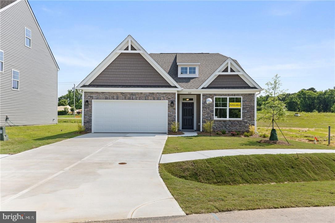 Hickory Grove is a new 55+ community in Ashland offering first-floor primary suite floor plans for comfortable, low-maintenance living. The Burton is a beautifully designed ranch home offering three spacious bedrooms and two full baths. The sun-filled family room seamlessly flows into the kitchen, creating a bright, welcoming space for everyday living and entertaining. The thoughtfully designed kitchen offers a large island, a pantry, and an adjoining cafe area. The primary bedroom features a walk-in closet and an ensuite bath featuring a soaking tub, double vanity, and a water closet. Bedrooms two and three both feature a double-door closet and share a full hall bath with a tub/shower combo. Options to personalize this home include a covered porch, screened porch, or sunroom, and several primary bath options. Don't miss the chance to make this home your own! Lawn maintenance, irrigation, and trash are all handled by the HOA, giving you more time for the moments that matter most. Community amenities include walking trails, a dog park, a pond with a pier, pickleball, a community garden, a gazebo, and a fire pit. The neighborhood features spacious, open-concept designs with top-quality craftsmanship. Residents enjoy close proximity to downtown Ashland, dining, shopping, healthcare, and major routes like I-95 and Route 1. Hickory Grove provides the ideal setting to relax, connect, and embrace your next chapter.