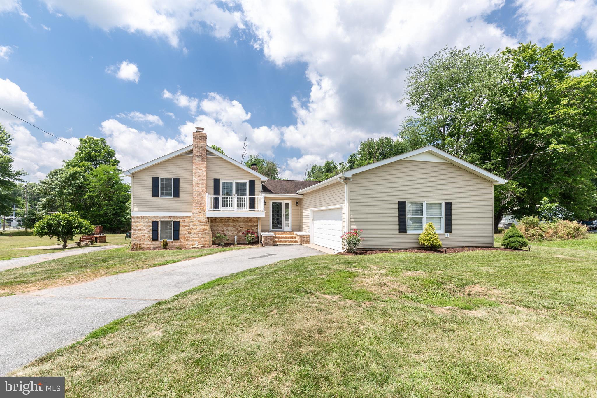 Over 3,400 square feet of finished living space across four levels! This spacious 4-bedroom, 3-bath home offers room for everyone, including a potential in-law suite with a private walk-out entrance. Enjoy three fireplaces, an updated kitchen featuring granite countertops and all appliances, hardwood floors, brand-new carpet, fresh paint, and soaring cathedral ceilings that create an open, airy feel. Step outside to your own backyard retreat with an in-ground pool, perfect for entertaining or relaxing all summer long. The oversized two-car garage provides ample storage and workspace. Conveniently located in downtown Thurmont, you'll enjoy easy access to shopping, dining, parks, and major commuter routes. This home offers the perfect combination of space, comfort, and convenience—don't miss it!