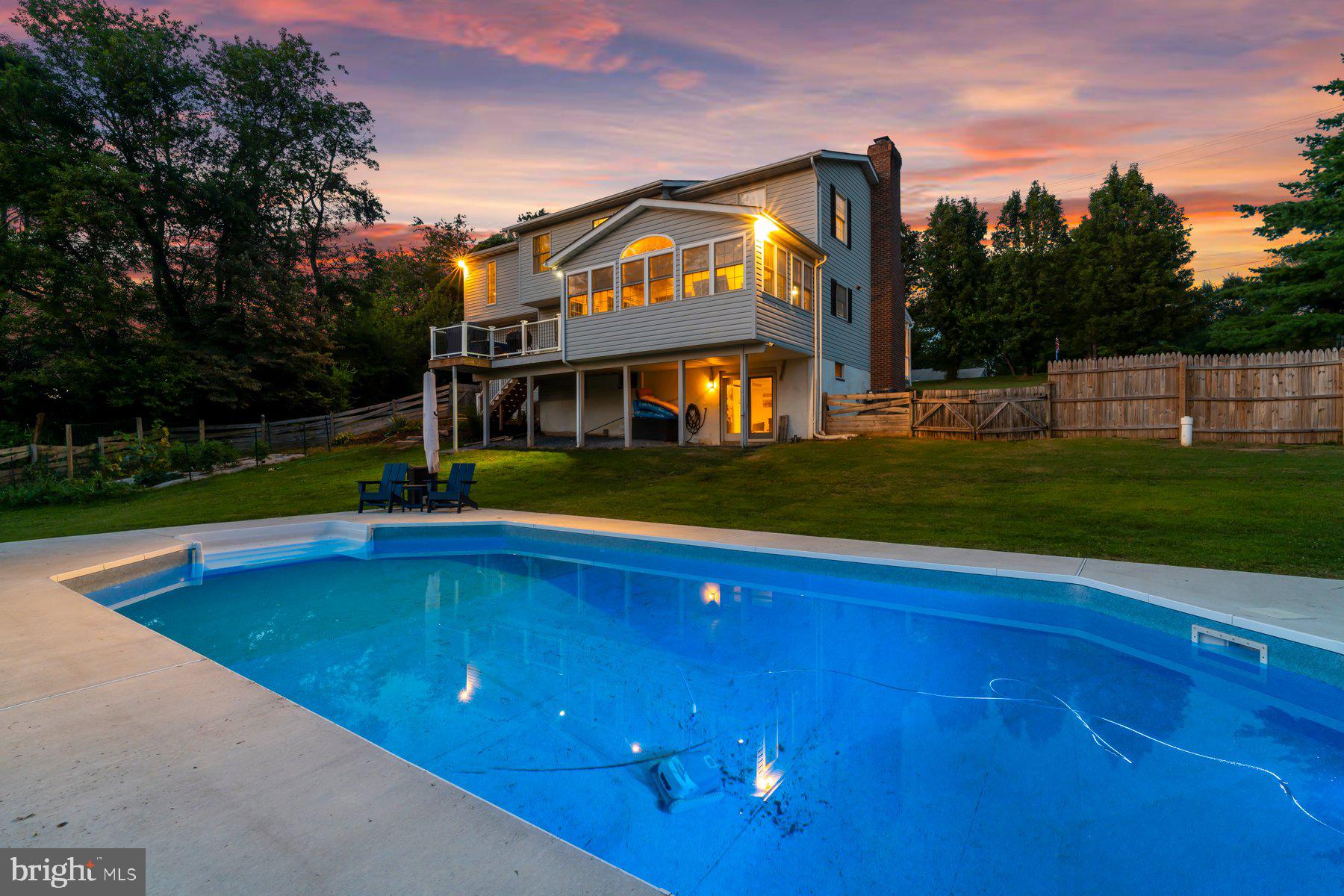 Welcome Home to a Lovely Retreat in the Hereford Zone! This beautifully updated 5 generously sized-bedroom, 3.5-bath home is your private oasis, complete with a brand-new in-ground pool and patio (2024), New pool fence (2026)—perfect for relaxing and entertaining. Step onto the expansive covered front porch and enter through a welcoming foyer that flows into the elegant dining room with a cozy wood-burning fireplace. The open-concept kitchen and dining area features a walk-in pantry, ideal for home chefs and families alike. Enjoy the spacious family room with vaulted ceilings, skylights, and direct access to a new maintenance-free deck—seamlessly blending indoor and outdoor living. The fully fenced rear yard is a private paradise, boasting fresh landscaping, a shed, and your sparkling new saltwater pool and patio. Upstairs, you'll find five generously sized bedrooms, including a luxurious primary suite with a large walk-in closet, jetted soaking tub, an updated walk-in shower, and dual vanities. A second bedroom offers an en suite bathroom with a stunning updated walk-in shower. Three additional bedrooms share a beautiful hall bath with tub/shower. Enjoy brand-new hardwood flooring throughout the upper level and fresh paint.  The finished lower level features a spacious recreation room with new carpet. The slider door allows plenty of natural light and opens directly to the patio and pool area. Laundry room on main level with shelving and cabinets. Two car oversized garage & mudroom. All new kitchen ss appliances 2024, New flooring upper level, new hardwood flooring in lower level, New HVAC 2023, New Deck 2024, New mini split in primary suite 2024.  Excellent location and schools!