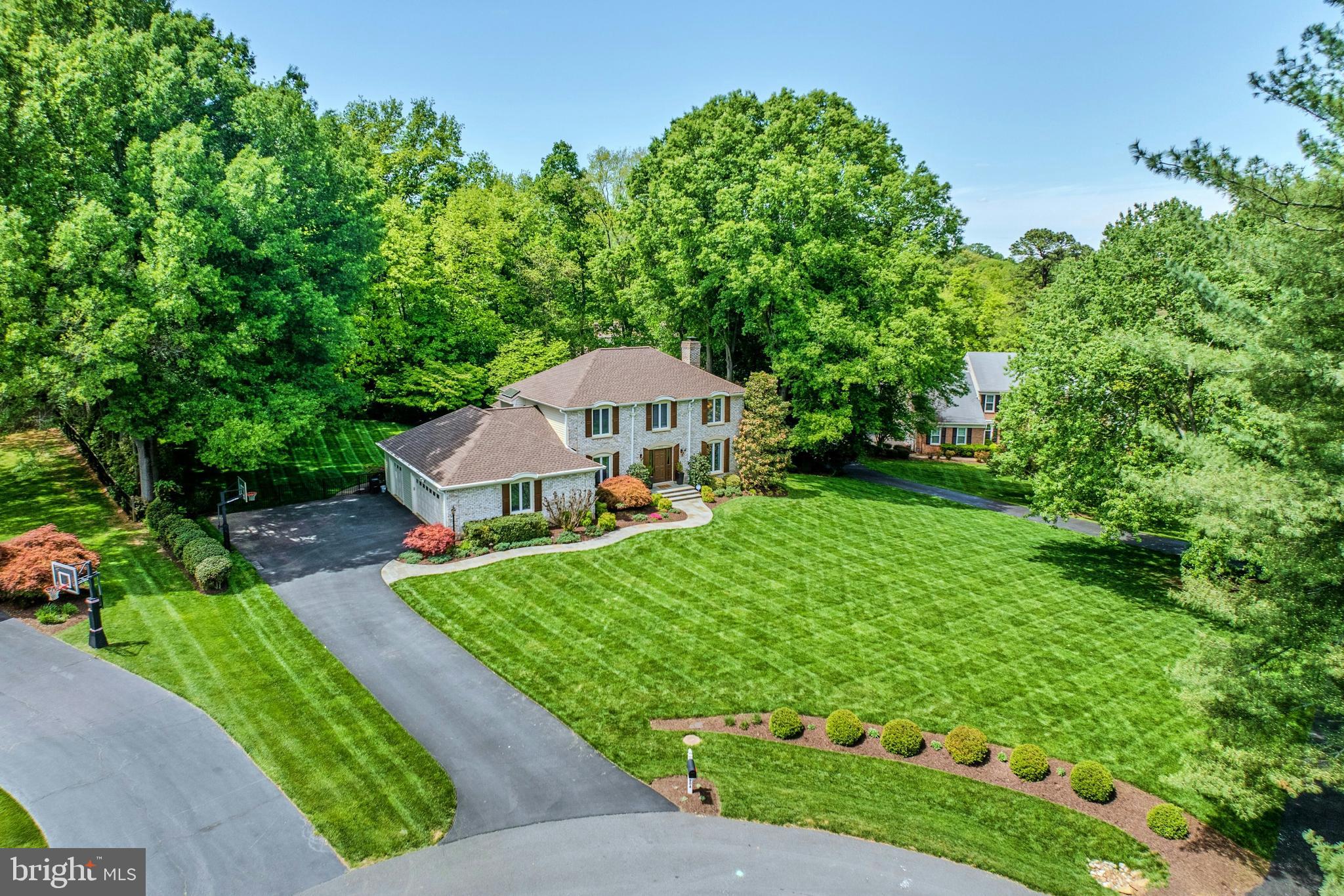 Welcome home to this tastefully appointed move in ready home peacefully situated on a .76 acre lot with a rear yard oasis including a screened in porch &  pool in the conveniently located Berryland Farm community of Oakton.  The custom walkway greets you as you enter this beautifully upgraded home with neutral paint & refinished hardwood floors on the main level. Private main level office is an ideal work from home space & formal dining room with custom built-in butlers pantry. The expansive great room with built-ins, wine refrigerator, gas fireplace & views of the rear yard. The gourmet kitchen was renovated in 2021 and features upgraded white cabinetry, custom backsplash, stainless steel appliances, Quartz counters & spacious eating area leading to screened in porch. The main level features a powder room and large mudroom with upgraded tile, cabinetry, access to the rear yard & leads to the 3-car garage with epoxy flooring. Spacious upper level primary suite with walk-in closet & spa inspired renovated bath with heated floor, soaking tub, oversized shower & dual vanity. The upper level features three additional spacious bedrooms & upgraded second full bath. The finished lower level features large recreation room, den, exercise room, third full bath & storage. The rear yard is a private fenced in oasis featuring large screened in porch, deck with hot tub, pool with surrounding lounge area & mature trees. Lawn irrigation system too! This home features many upgrades/updates including new casement windows (2026), roof & siding (2025), gutters (2024), pool pump/heater/filter (2024), carpet (2021), Carrier Infinity HVAC system with humidifier (2018) and more! The Berryland Farm community features tennis, pickleball, basketball courts, playgrounds and walking paths!  Peacefully situated with incredible privacy while still conveniently located near shopping, dining, entertainment & commuter routes. Sought after Flint Hill Elementary, Thoreau Middle School & Oakton High School pyramid! Open House Saturday 12:00 - 2:00!
