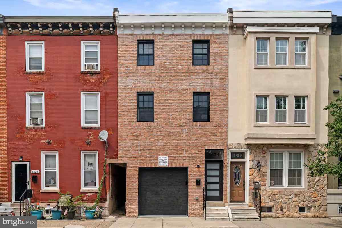 Get ready to experience unparalleled luxury in the heart of Graduate Hospital! This spectacular 4-bedroom, 3 full bath, and 2 half bath home has been renovated from top-to-bottom. Thoughtfully designed with high-end finishes and modern elegance, this residence offers both style and functionality in one of Philadelphia’s most sought-after neighborhoods. Step inside to find soaring ceilings, gorgeous white oak floors, and an open-concept layout that perfectly blends sophistication and comfort. The first floor features a private attached garage with an additional parking space in front—providing the rare convenience of two-car parking. Beyond the garage, the beautifully designed kitchen, living, and dining areas await, complete with a waterfall-edge countertop, wood-grained cabinetry, and sleek high-end tile. A stylish powder room completes the space, making it perfect for both everyday living and entertaining. The second floor boasts two generously sized bedrooms, each with its own spa-like ensuite bathroom, offering privacy and convenience. Upstairs on the third floor, two additional bedrooms provide ample space for guests or a home office, accompanied by a beautifully designed full bath. A dedicated laundry room with an extra half bath ensures effortless convenience for busy lifestyles. Beyond its breathtaking interiors, this home is situated in the vibrant Graduate Hospital neighborhood, where city living meets community charm. Just minutes from the iconic Rittenhouse Square, residents can enjoy top-tier dining, boutique shopping, and cultural attractions. South Street’s eclectic energy, the scenic Schuylkill River Trail, and an array of popular cafés and restaurants, including Café Ynez and Los Camaradas, are all within easy reach. Commuting is effortless with convenient access to SEPTA bus routes and the Broad Street Line, making Center City and beyond just moments away. This exquisite home is the perfect fusion of luxury, location, and lifestyle. With its impeccable finishes, unbeatable parking, and prime location, this is a rare opportunity to own a brand-new masterpiece in Graduate Hospital! Seller is a licensed real estate agent.
