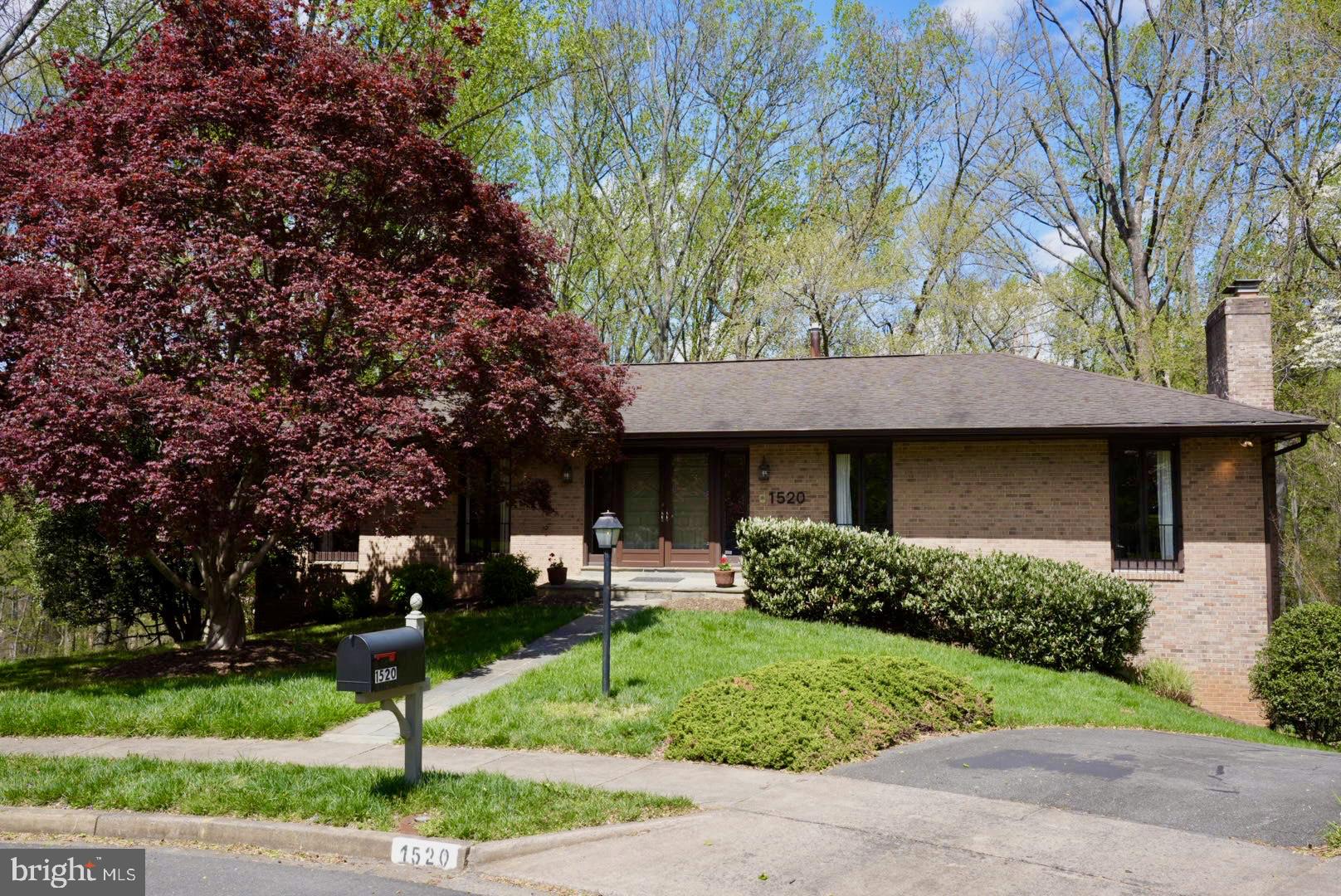 Welcome to Your Perfect Retreat Just Minutes to DC!
Nestled on a quiet cul-de-sac in the highly desirable Chain Bridge Forest neighborhood, this beautifully updated home offers everything you want—updated kitchen and bathrooms, spacious rooms, new paint, and nature all around. 
Inside the home, you’ll find generous living spaces filled with natural light, an open and updated kitchen, and the primary bedroom on the main level. The home boasts two fireplaces, gleaming hardwood floors, built-in shelves, three renovated bathrooms, and elegant French doors leading to a deck with a view of the private backyard.  
The home sits on a private, oversized 13,042 square foot lot. The backyard has an expansive play area that backs to serene trees and a gentle creek.
The main level offers an ideal layout for family living: a spacious formal living room with a fireplace for cozy evenings; a large dining room, opening directly to the deck for easy indoor-outdoor living; and a sunlit, updated kitchen with a large island with a breakfast bar and lots of storage. 
Three bedrooms on the main floor include a private owner's suite with a tastefully renovated bathroom and a huge walk-in closet. There's also a renovated second full bath, and a convenient main-level laundry room — perfect for busy family life.
The updated kitchen is equipped with Jenn-Air upscale SS appliances, a Bosch dishwasher and  a Zephyr Range Hood. These top-of-the-line appliances include two ovens, a counter-depth French door refrigerator, a gas stovetop, and an instant hot water heater. Documents regarding the appliances ready for the new buyer.
Downstairs, the fully finished lower level is built for fun and functionality, featuring: a massive newly carpeted recreation room with abundant custom shelving and a second fireplace; two additional large bedrooms, a fully updated bath, and a bonus room behind the two-car garage.
Outside, the beautifully landscaped yard is ready for memories to be made — from birthday parties to summer BBQs on the large deck with a built-in gas grill. Connected to this home is a Generac Generator, easily accessed but out of sight situated under the raised deck in case of rare power outages.
Location is key for families — you're just minutes to top-rated schools (Chesterbrook Elementary, Longfellow Middle, and McLean High School), local trails like Pimmit Run, and close to Tysons Corner for shopping, dining, and family fun. Commuting is a breeze with quick access to the GW Parkway, Chain Bridge, I-495, and downtown DC.
This is more than a house — it's the perfect place for your next chapter!