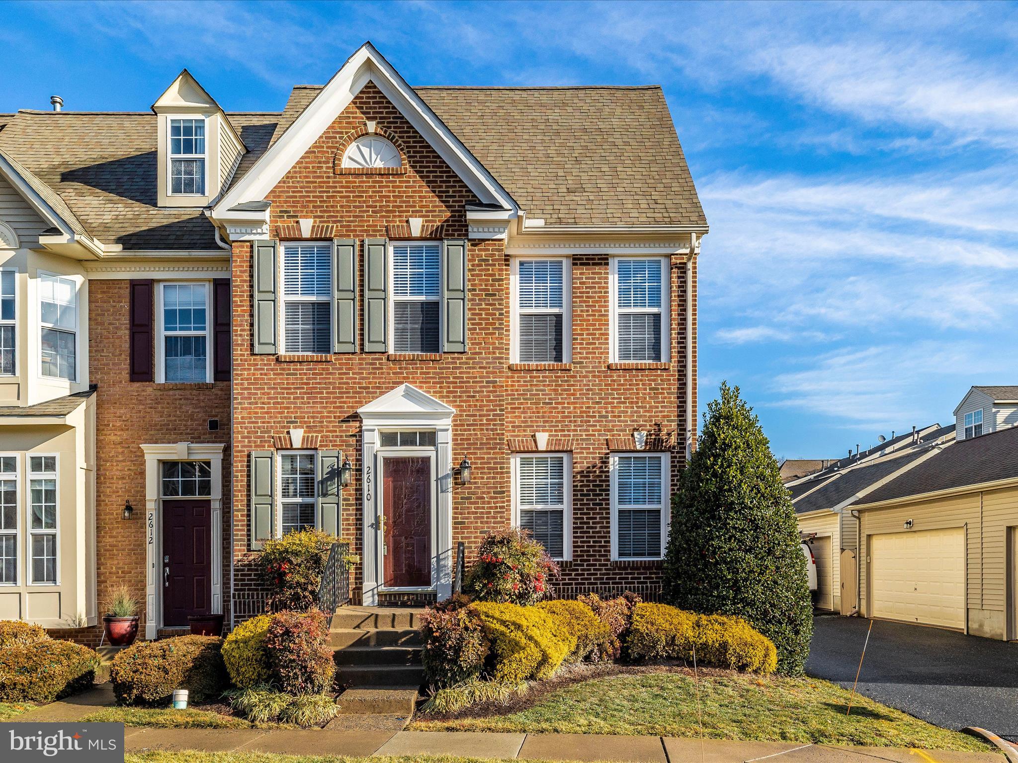Gorgeous, end unit, Bentley Model, with over 3,000 finished square feet, on Mill Island in Worman's Mill.  The perfect townhome you've been waiting for!  Welcome home to 2610 Island Grove Blvd.  This beautiful and spacious home is move in ready, professionally landscaped, and has been lovingly cared for.  When you enter this home, the grand staircase and beautiful hardwood floors will welcome you.  The main level has a formal living and dining room, kitchen with eat in space and silestone quartz countertops, a family room with gas fireplace, and a powder room.  Hardwood floors flow throughout this level.  An abundance of windows offer lots of natural light.  Off the kitchen, is a deck and hardscaped backyard.  The backyard is fully fenced and leads to your 2 car detached garage.  Upstairs, you will find a grand primary bedroom with cathedral ceiling, and ensuite.   A large walk-in closet and dressing area complete this space.  There are two more bedrooms and a second bathroom on this level.  The basement is fully finished, and has a full bath.  Worman's Mill is ammenity rich and conveniently located. It's close to shops, restaurants, and a quick drive to downtown Frederick.  Come visit and see all this wonderful home and neighborhood has to offer you.