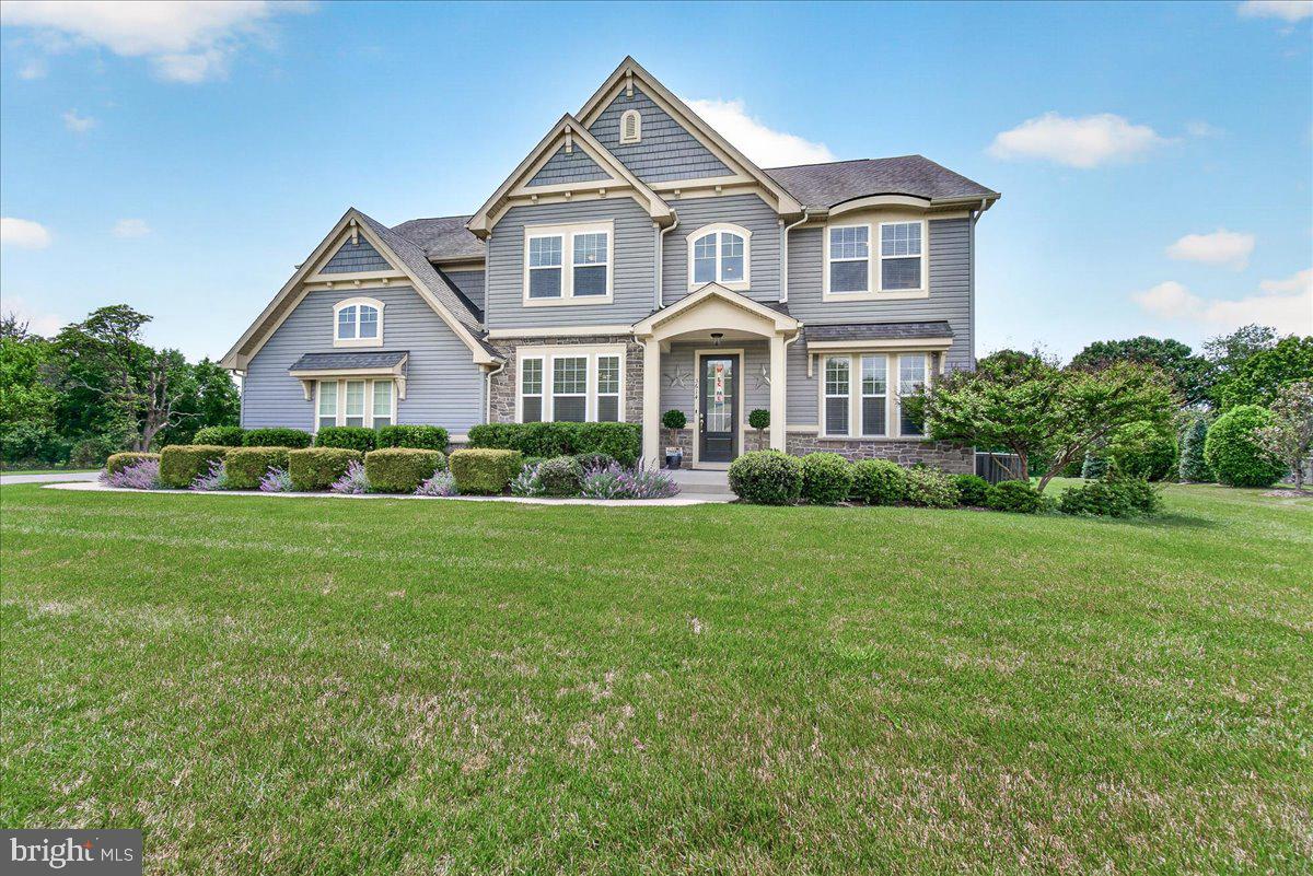 Located in Coveted Gladhill Estates, this stunning craftsman-style Ash Lawn model offers approximately 5,000 square feet of beautifully designed living space featuring 4 bedrooms, 3.5 baths, and exceptional indoor and outdoor living areas throughout. From the moment you arrive, the home impresses with outstanding curb appeal and elegant exterior details. Inside, the main level showcases gorgeous hardwood flooring, an open and inviting floor plan, and an expansive family room seamlessly connected to the gourmet kitchen featuring a large center island — perfect for entertaining and everyday living. Upgraded finishes all throughout. The luxurious owner’s suite is a true retreat complete with a spa-inspired bath designed for comfort and relaxation. The upper level has three additional large bedrooms, upper level laundry and an enormous loft. The finished lower level provides incredible additional living space ideal for recreation, fitness, media, or guest accommodations. Step outside to enjoy the large covered deck overlooking an exceptional backyard setting — the perfect space for gatherings, quiet evenings, and outdoor enjoyment year-round. Located in the highly sought-after Urbana High School district and just minutes from major commuter routes, shopping, dining, and everyday conveniences, this remarkable home combines luxury, comfort, and an unbeatable location. Oversized garage with room for up to 3 vehicles