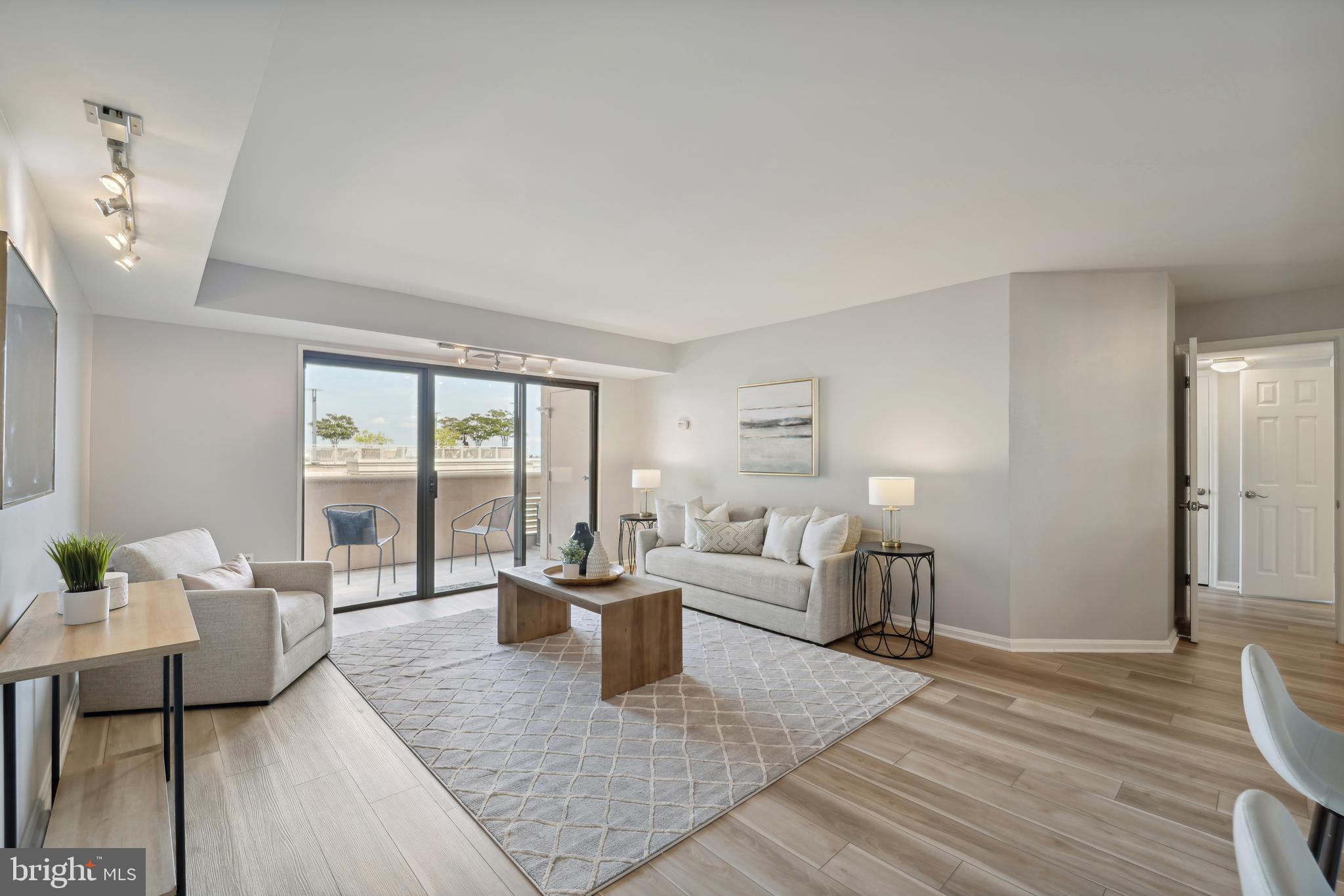 Welcome to this large, updated 2-bedroom, 2-bathroom condo in Courthouse! This residence features 1,150 square feet of living space, renovated bathrooms, and upgraded LVP flooring throughout 
the condo. 

The spacious living area receives excellent natural light and leads out to the balcony. The condo has eastern exposure and features fantastic views toward DC.  

With an open floor plan, the living room seamlessly flows into the separate dining area. The kitchen overlooks the living area and comes with plenty of cabinet space. 

The bedrooms are located on opposite sides of the living area for additional privacy. The primary bedroom comes with an en-suite bathroom that features a glass shower and double sink vanity. 

The second bedroom is generously sized and also has an entrance out to the balcony. 

Both bathrooms are renovated and feature modern fixtures and sleek finishes. 

The condo comes with one reserved parking spot. and extra storage.

Residents of Woodbury Heights enjoy the building's amenities such as the pool, fitness center, 24-hour front desk, and on-site management.
 
Located in the heart of Courthouse, this condo offers a prime location with easy access to a variety of area amenities. Enjoy the active neighborhood with its varied selection of restaurants, cafes, and shops just moments away. 

Schedule a showing today and experience the best of Arlington living in the sought-after Courthouse neighborhood!