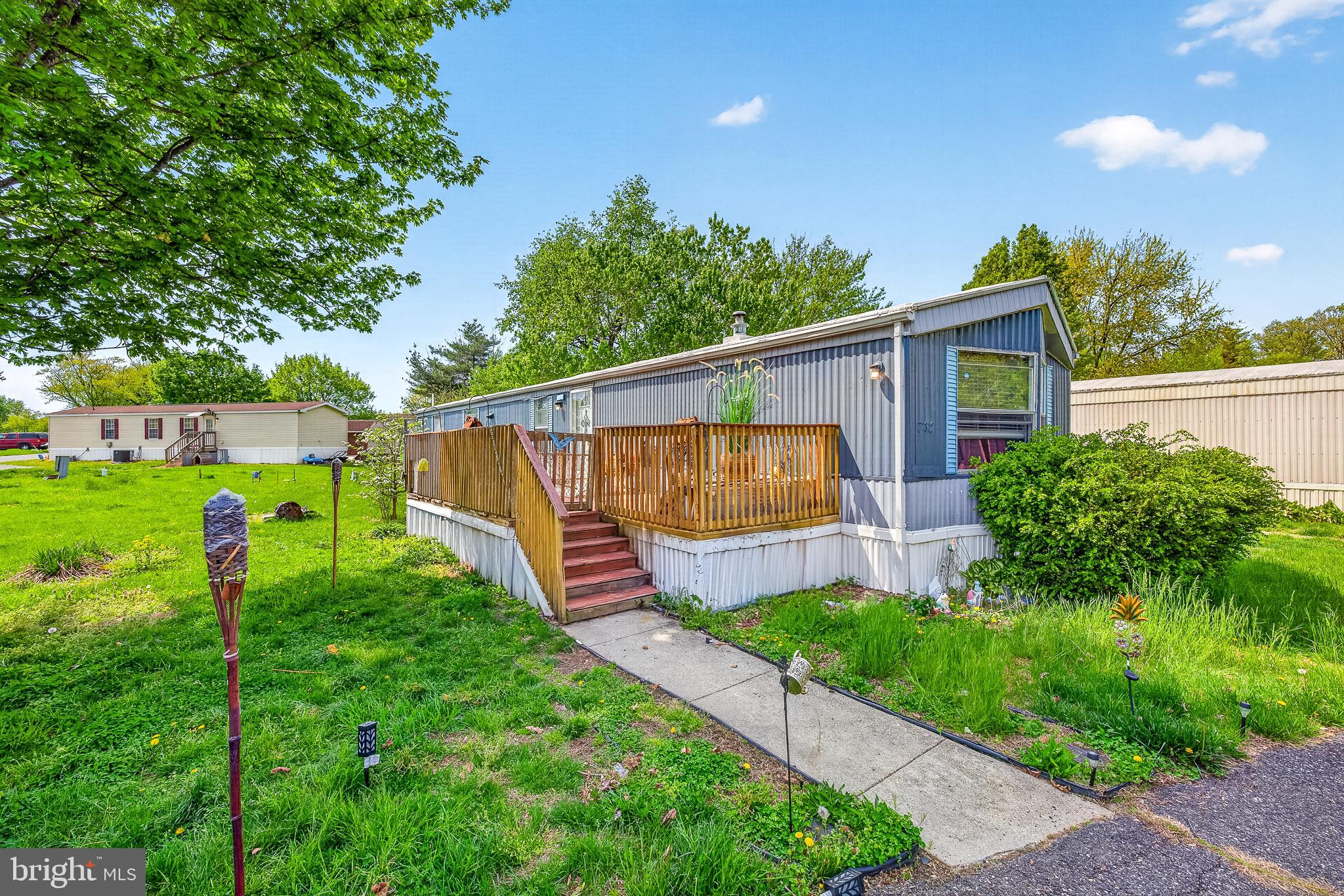 Spacious and full of potential, this mobile home features multiple bedrooms, two full bathrooms, and a functional layout designed for comfortable living. Enjoy a bright kitchen, a cozy primary bedroom, and a versatile flex room perfect for a home office, guest space, or hobby area. Step outside to a large private deck, ideal for relaxing or entertaining, along with a storage shed for added convenience. Nestled on a lot with mature trees and open green space, this home offers both comfort and opportunity. Schedule your tour today!