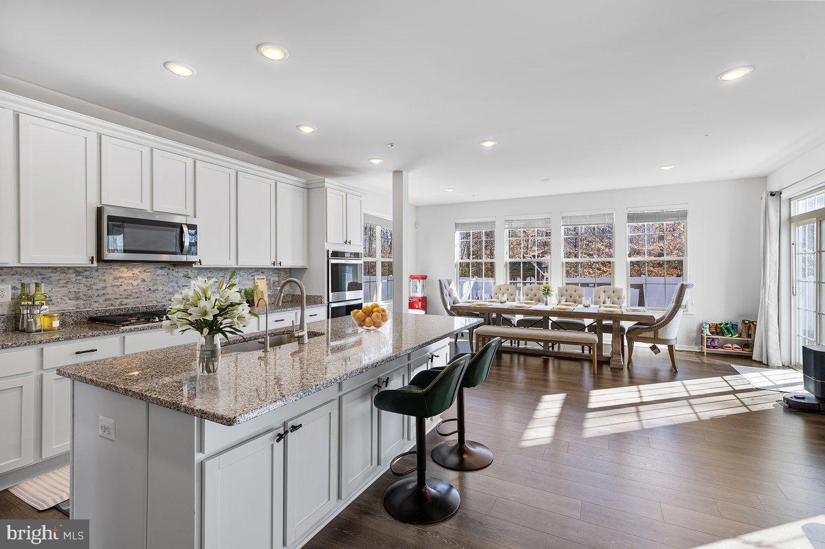 NOW OFFERED AT $665,000! Seller is offering 2% closing cost assistance with a full-price offer. Discover the perfect blend of modern construction, generous living space, and commuter convenience in this beautifully maintained 2021 Caruso Homes Michigan floor plan. Offering over 4,000 square feet of finished living space, this home is thoughtfully designed for today's lifestyle with spacious rooms, an open flow, and flexible living areas throughout. The main level features 9-foot ceilings, formal living and dining rooms, a large family room, and a gourmet kitchen complete with granite countertops, stainless steel appliances, double wall ovens, cooktop, tiled backsplash, island sink, abundant cabinetry, a Butler's pantry, walk-in pantry, and breakfast area. Upstairs, you'll find four spacious bedrooms, including a well-appointed primary suite with two walk-in closets and a private bath, plus the convenience of second-floor laundry. The finished lower level provides exceptional bonus space with a large recreation room, bathroom rough-in, and additional unfinished area ready for a future bedroom, office, gym, media room, or storage. Outside, enjoy a fenced backyard with patio and the added benefit of the adjacent open lot that is not expected to be developed, creating a more private setting. Conveniently located just minutes from Washington, DC, MGM National Harbor, Joint Base Andrews, Joint Base Anacostia-Bolling, Route 210, Route 301, and the Capital Beltway, this home also offers easy access to shopping, dining, parks, and recreation. Homes offering over 4,000 finished square feet, newer construction, and a 2% seller concession are becoming increasingly difficult to find. Schedule your private showing today and see everything this home has to offer.