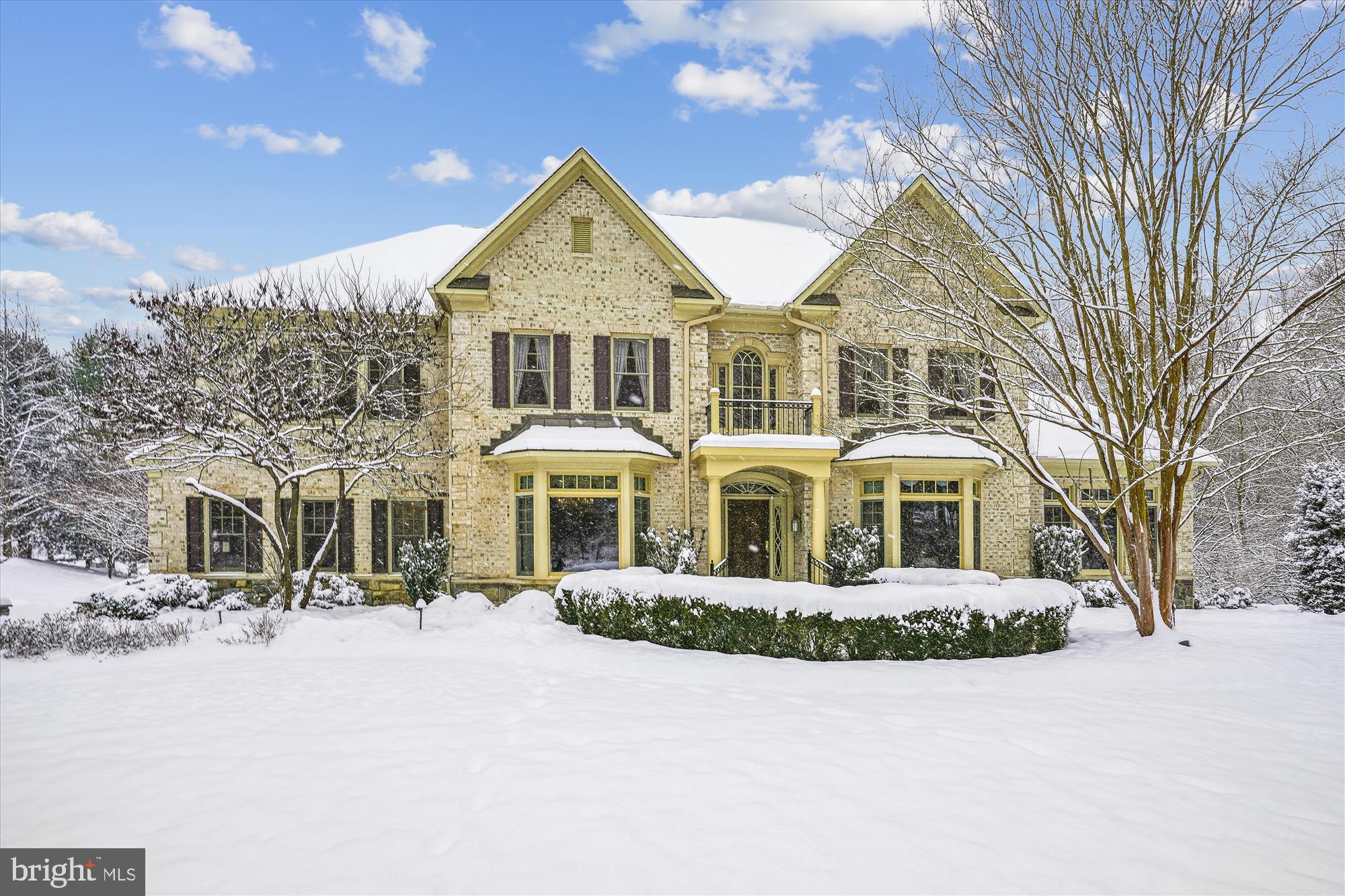 This exquisite brick and stone Renaissance built Colonial with 3 car side load garage with EV charger, 5 bedrooms, 5 full and 3 half bathrooms will not only impress you but will welcome you to stay.  A brand new asphalt driveway provides  abundant off street parking  for guests as well. 

Enter the dramatic 2 story foyer and be awestruck by its sheer size, beautiful hardwood flooring, decorative pillars and graceful curved staircase. The banquet-sized formal dining room with bay window and crown molding lies on one side of the foyer while on the other side is the formal living room with bay window, fireplace and crown molding. Both rooms are elegant and inviting.  Perhaps even more inviting is the 2 story family room with fireplace and enormous Palladian windows providing abundant natural sunlight as well as breathtaking views of the spectacular property. Flanking the family room fireplace are French doors leading to 2 romantic Romeo and Juliet balconies and with a separate third access from the family room to the rear deck, this room is destined to be the go-to spot, after the kitchen.  The enormous and well designed chef’s kitchen is perfect with stunning, rich-toned and abundant cabinetry and counter space, high-end appliances, center island with cooktop and breakfast bar, the sunlit breakfast area nestled by a bay window and access to a private balcony. The expansive main level also boasts a beautiful study with fireplace, a sunroom, appropriately named, 2 powder rooms, the laundry room and a rear staircase.

The upper level features a lovely landing overlooking the foyer and the family room plus 4 bedrooms with en-suite bathrooms, all worthy of a 5 star hotel.  The owner’s suite is magnificent with its sitting room with fireplace and its luxurious and large bathroom with separate vanities, spa tub and separate shower.

The fun never ends on the lower level with its immense recreation room with large and stunning wet bar and the fifth fireplace, tiered theater room, a gym and a fitness room, a full kitchen, a powder room and a guest suite with a private full bathroom.

Found throughout are recessed lighting, stunning hardwood flooring, beautiful architectural details, intricate millwork and numerous built-ins plus an elevator with access to all 3 floors and the garage.

Magnificently sited on over an acre lot, it would be hard to find a more picturesque and serene vista.  The entire property offers extensive stone work with 2 rear patios connected by a stone bridge over the bubbling pond and waterfall, and the most glorious views of the pristine lake surrounded by untouched rolling hills. Located on a private cul-de-sac, backing to common area and in a highly desired Oakton community with walking trails, this impressive stunner is also just minutes to Metro, shopping, dining, parks, Wolf Trap and commuter routes. Also, with four HVAC systems and a back up gas fired generator,  you will never suffer for keeping cool even when the power goes out. 

It’s time to enjoy the good life.